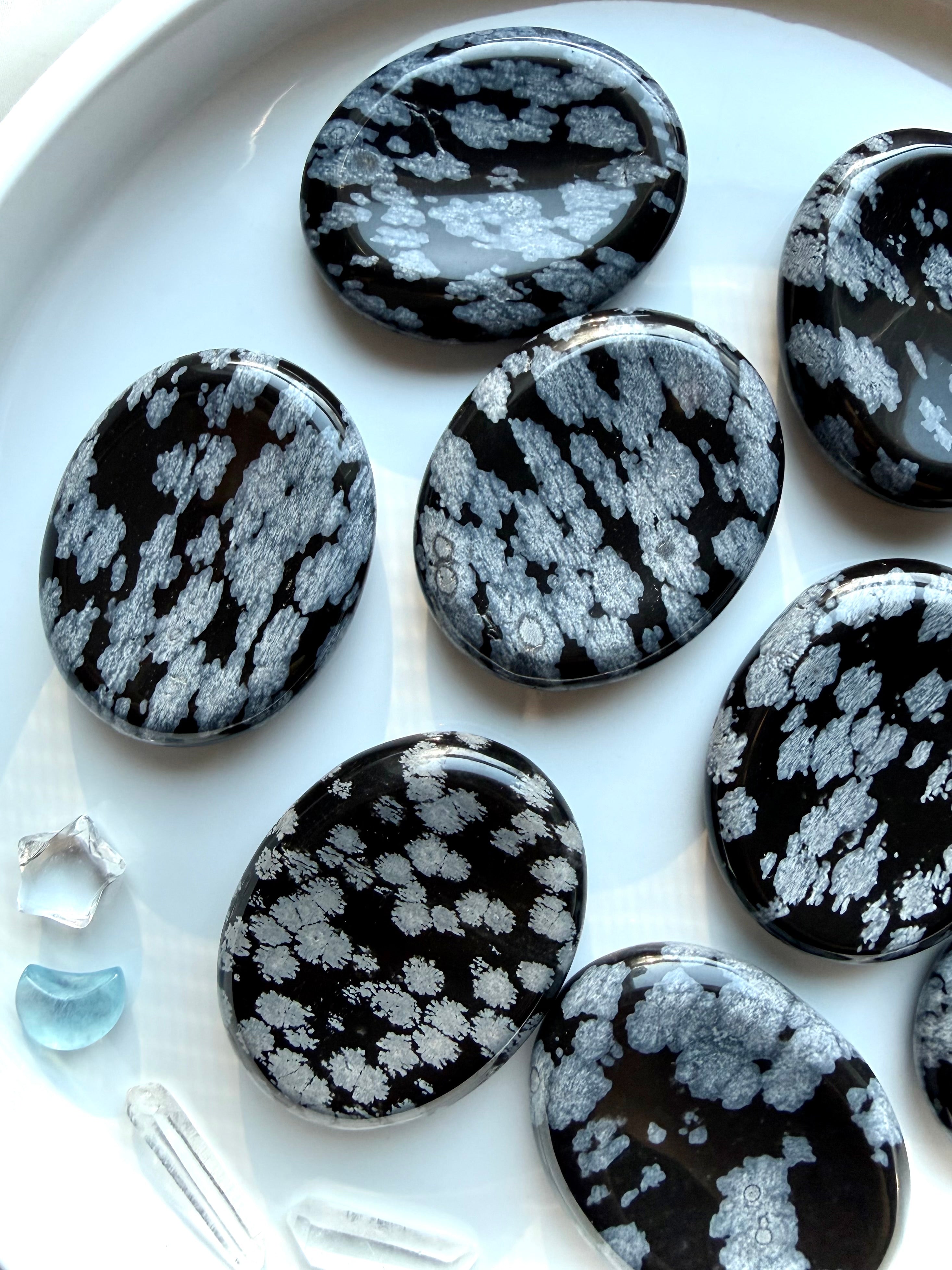 Snowflake Obsidian worry stones showing detailed silver crystal formations for grounding and emotional healing