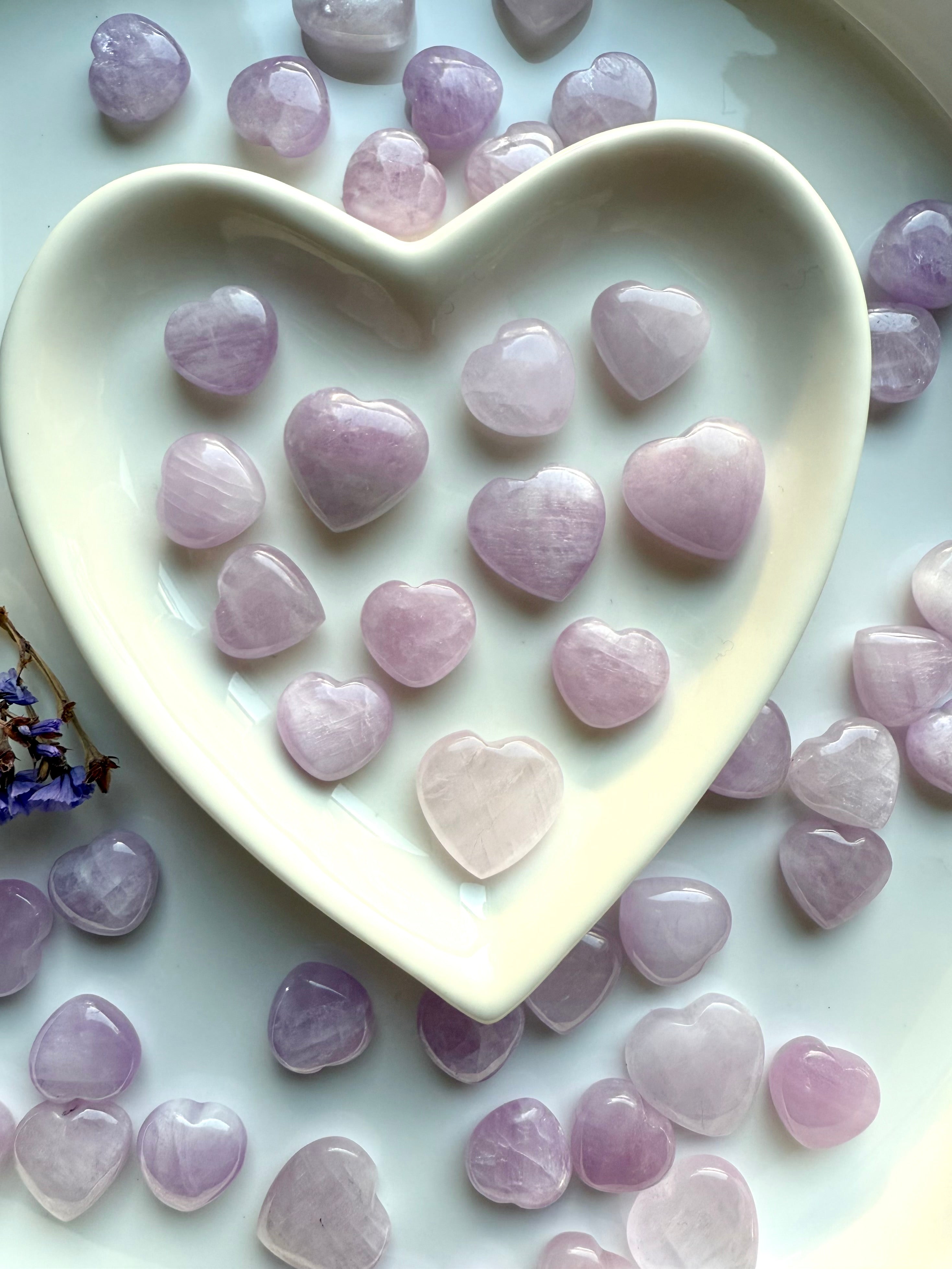White heart bowl filled with Mini Pink Kunzite hearts — high-vibe crystals for love & heart chakra healing.