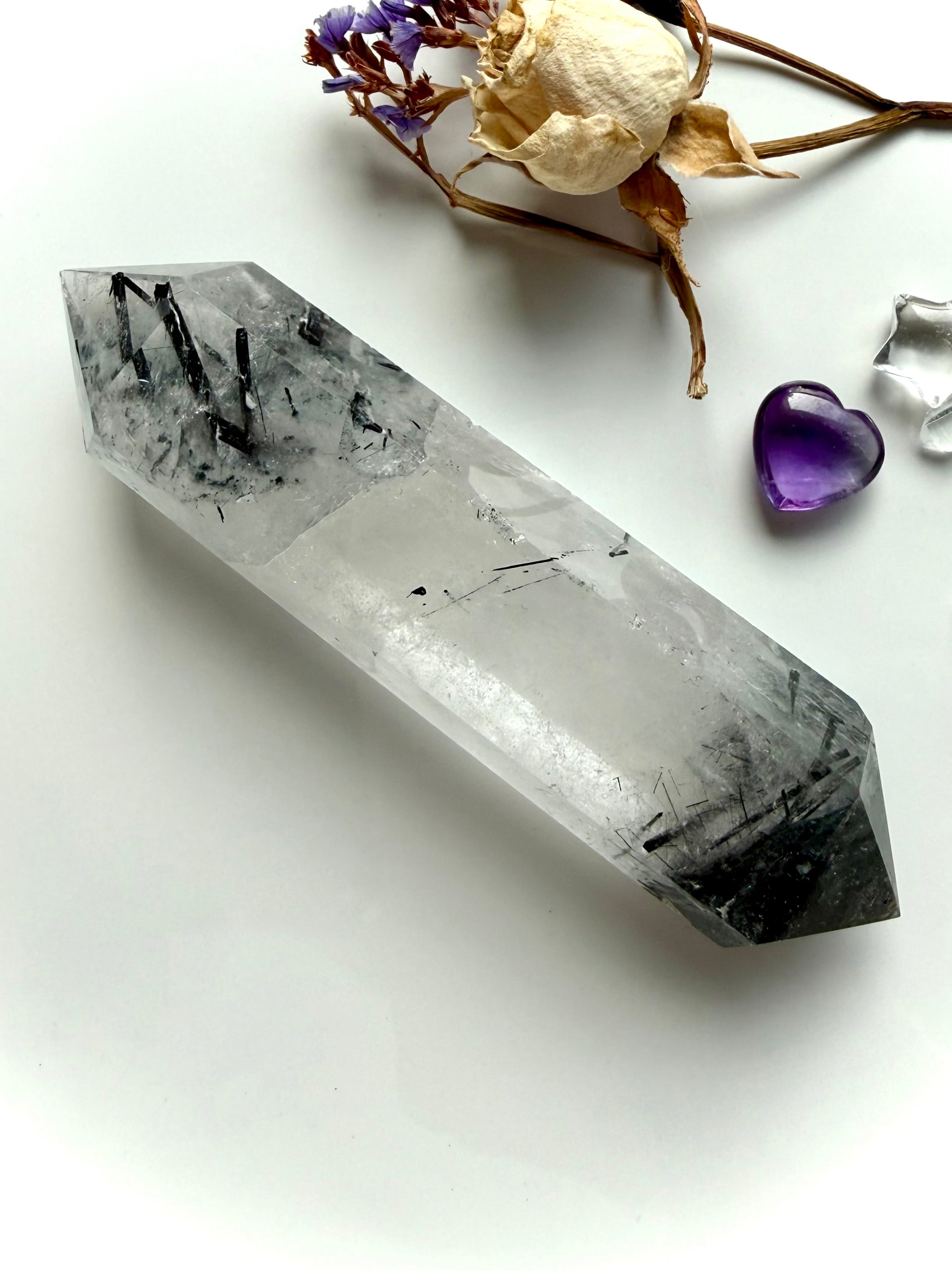 tourmalinated quartz double terminated crystal with inclusions concentrated at both ends