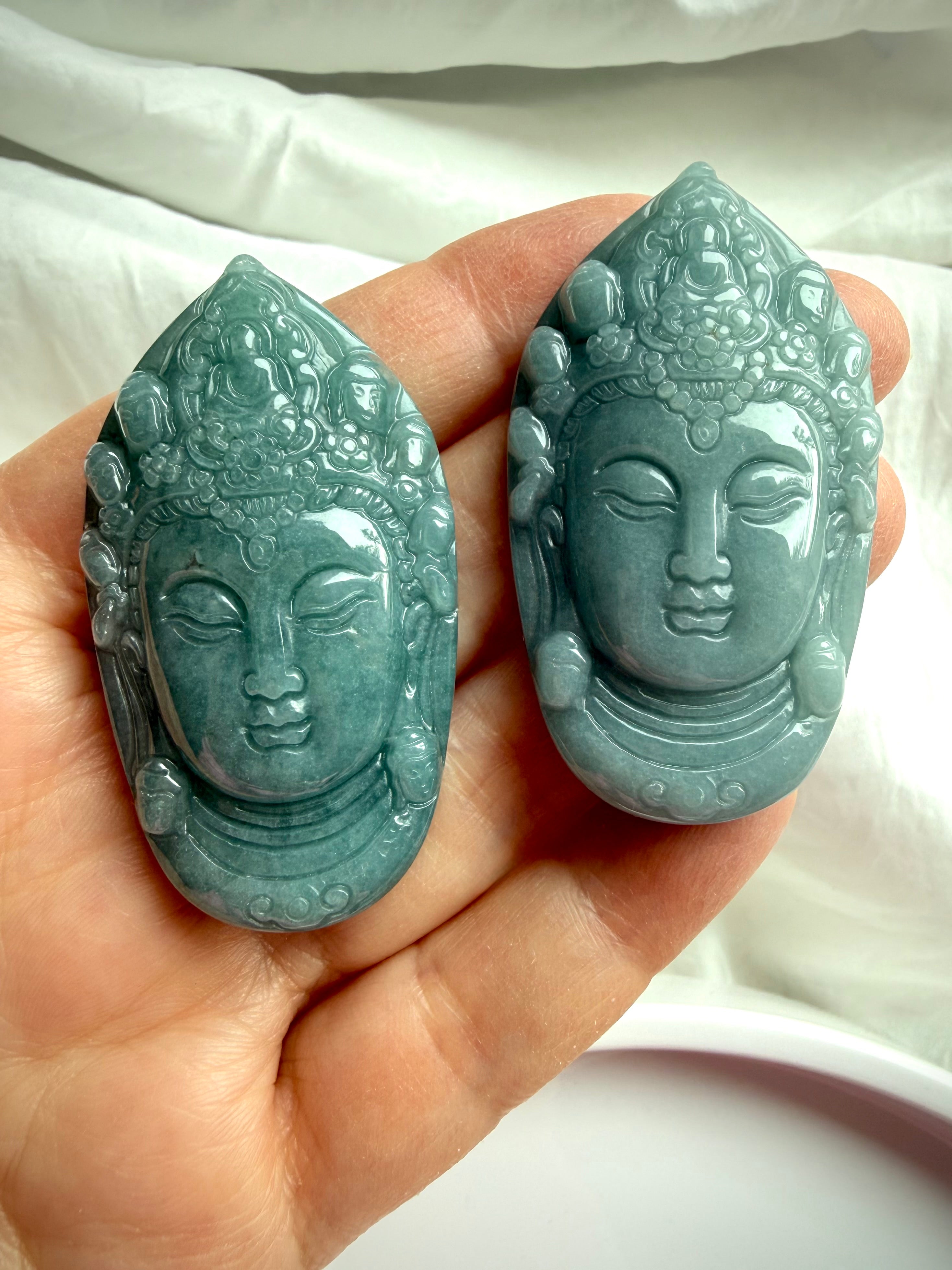 Blue Water Jade Quan Yin head pendant carvings held in hand showing size and natural variation