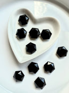 Multiple faceted Black Obsidian hexagons in ceramic heart dish