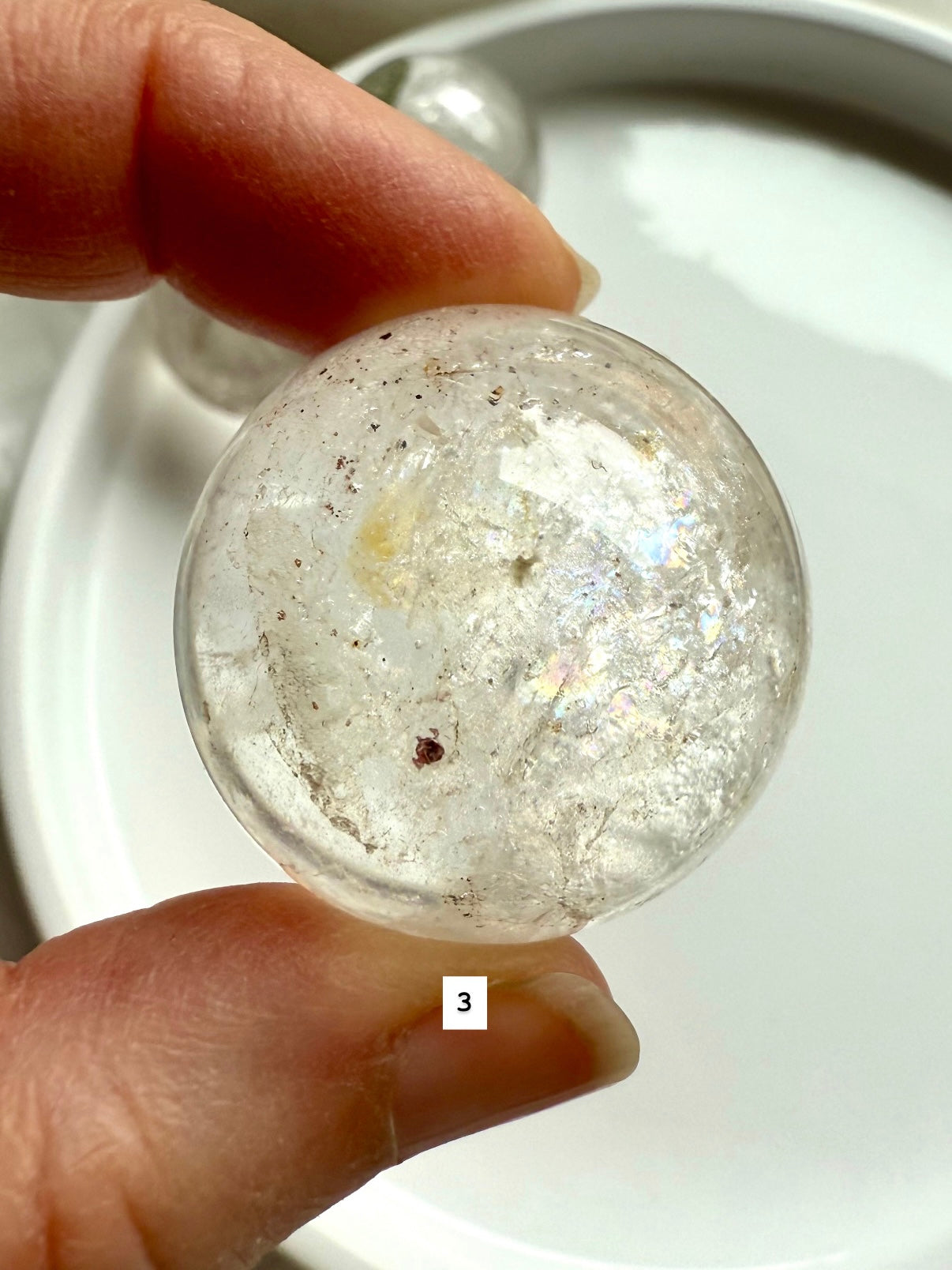 close up of a garden quartz sphere – mineral-filled lodolite for spiritual focus and grounding