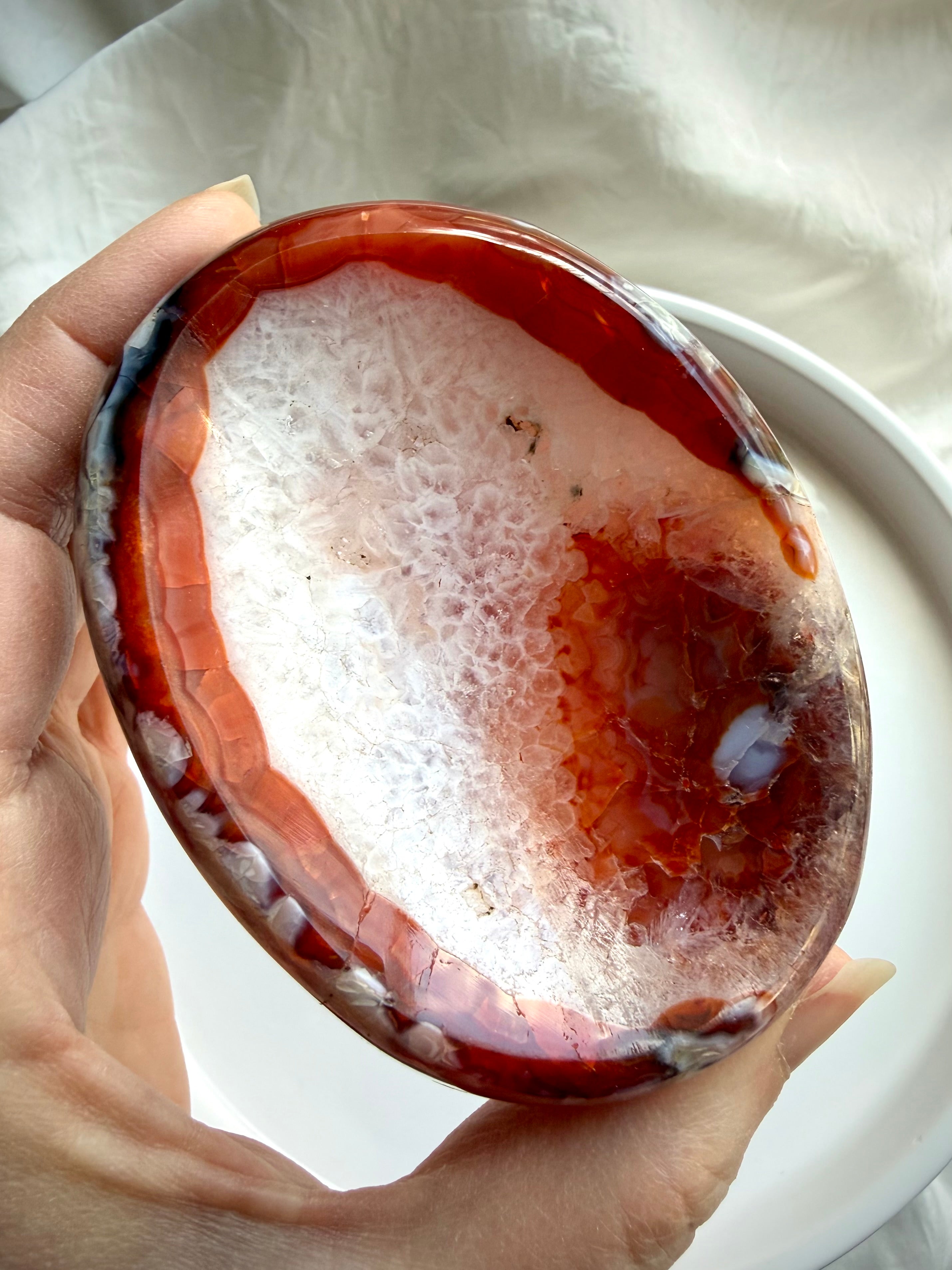 carnelian crystal bowl with white quartz center and agate banding polished gemstone dish for jewelry and altar use
