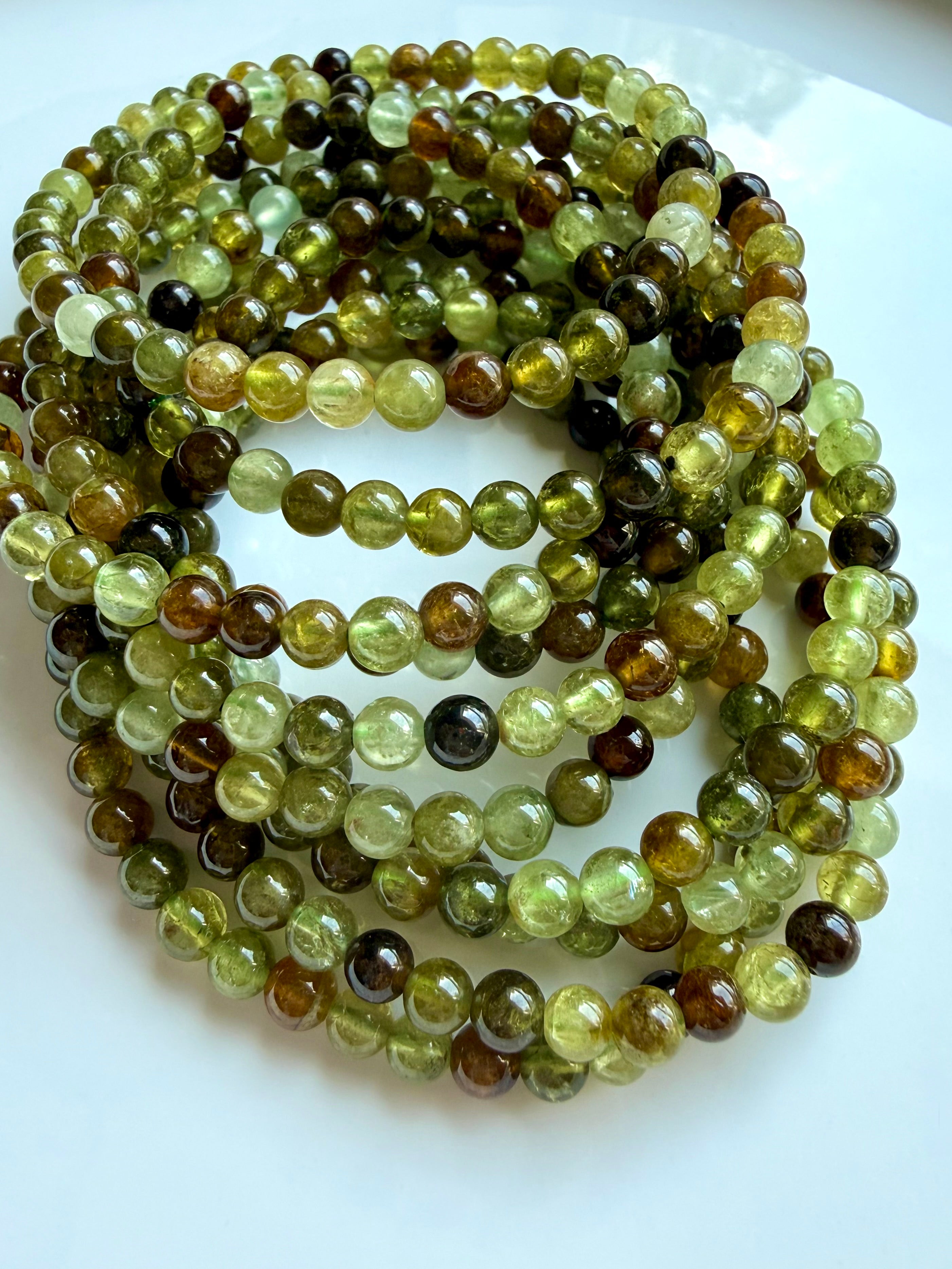 Premium green garnet bracelet stack with natural Tsavorite gemstones in chartreuse and amber hues