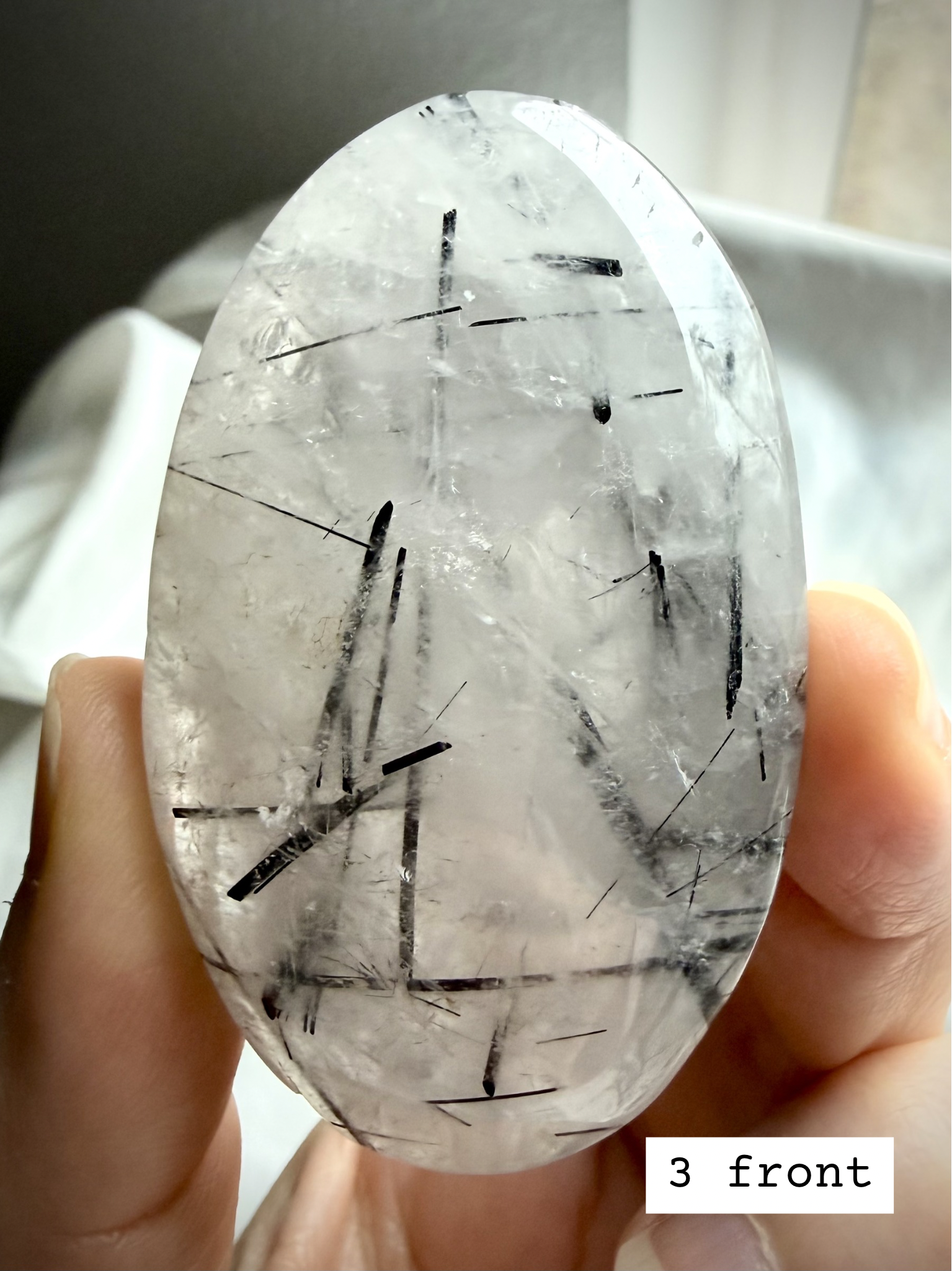 Black Tourmaline in Quartz palm stone 3 front view Tourmalinated Quartz protection stone