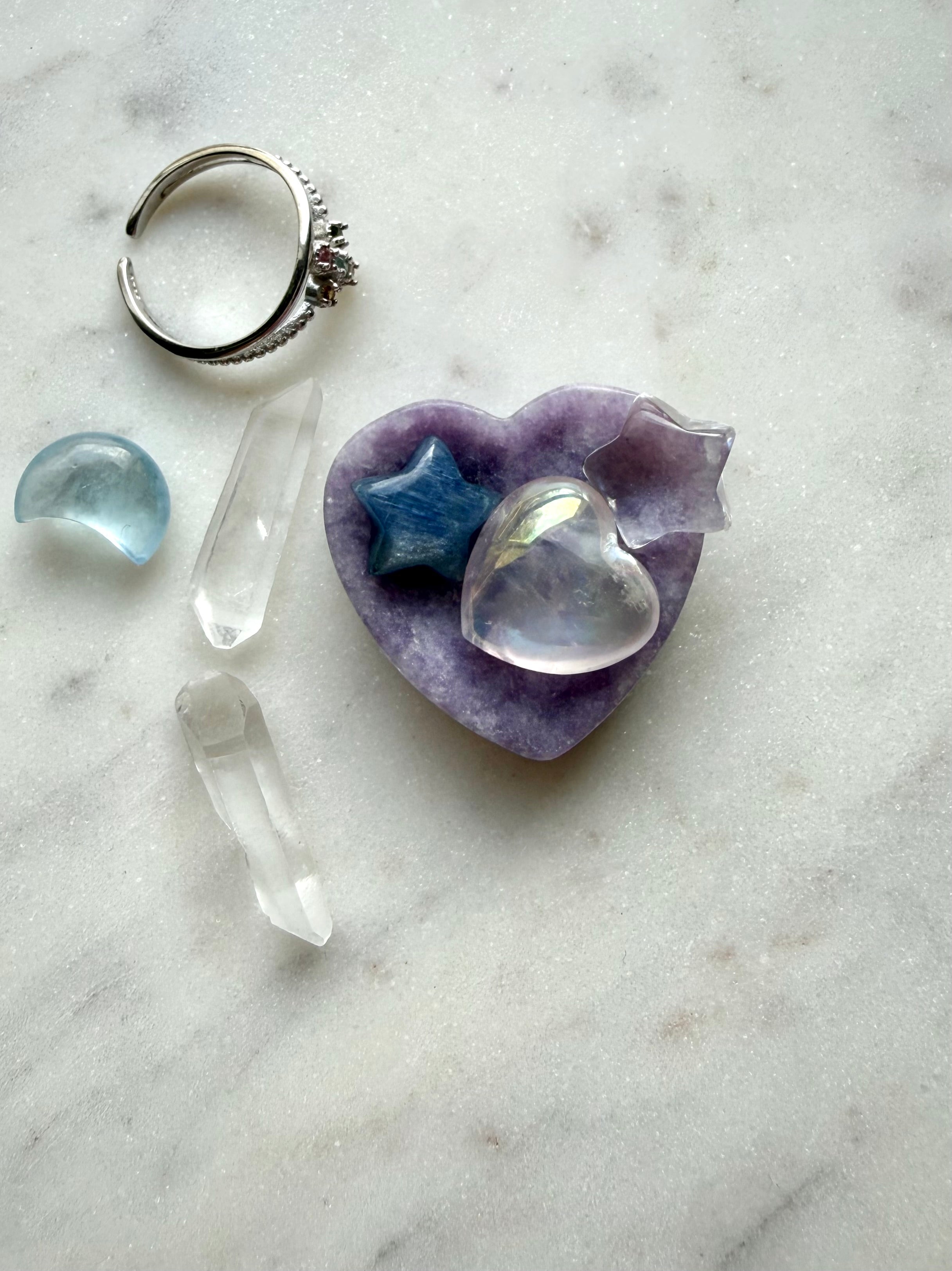 Mini Lepidolite heart bowl used as a crystal jewelry dish with tiny crystals for whimsical vanity décor