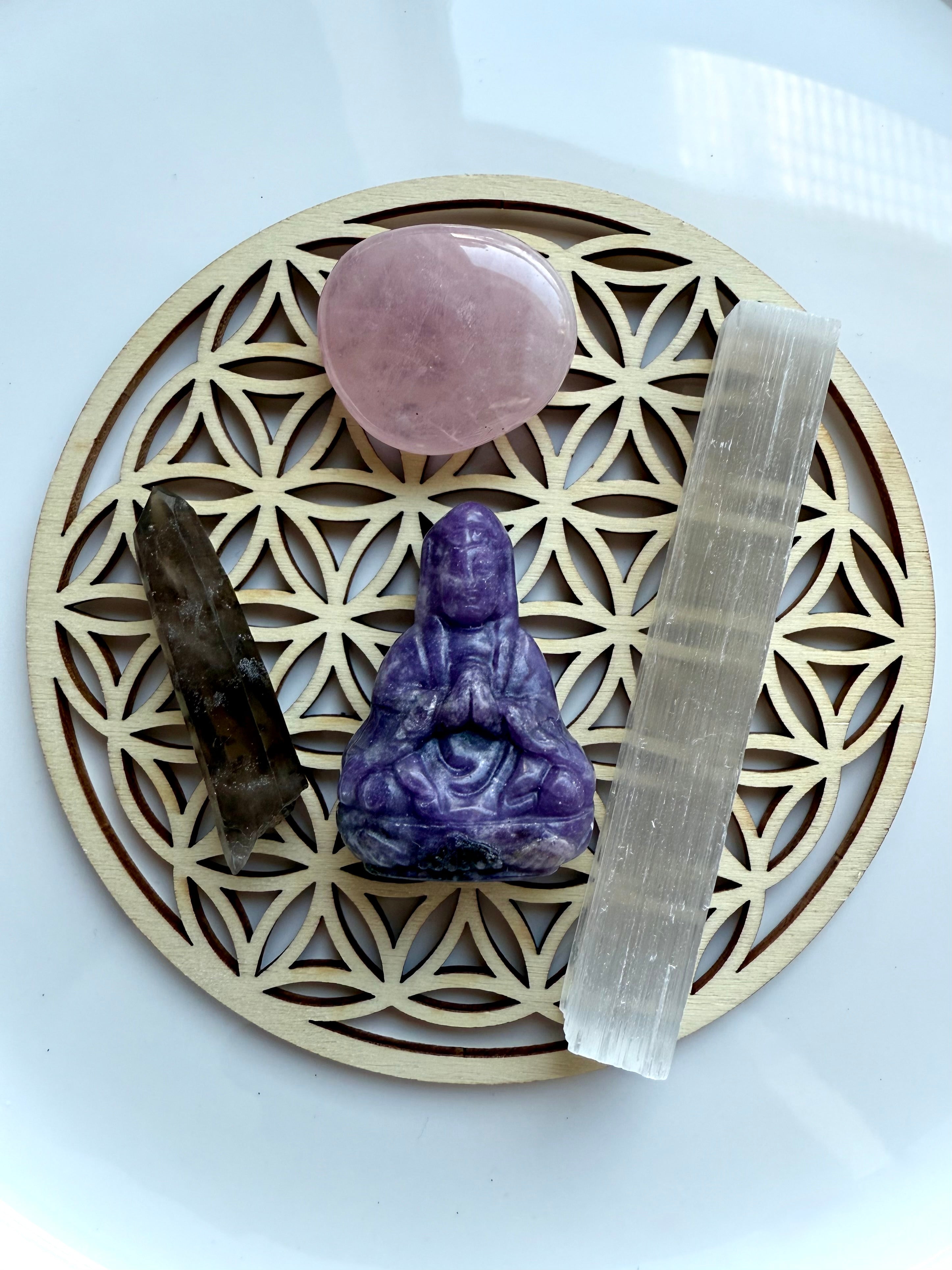 Crystal arrangement of Lepidolite Quan Yin, rose quartz, smoky quartz + selenite on wooden Flower of Life grid – sacred travel altar set for peace and protection