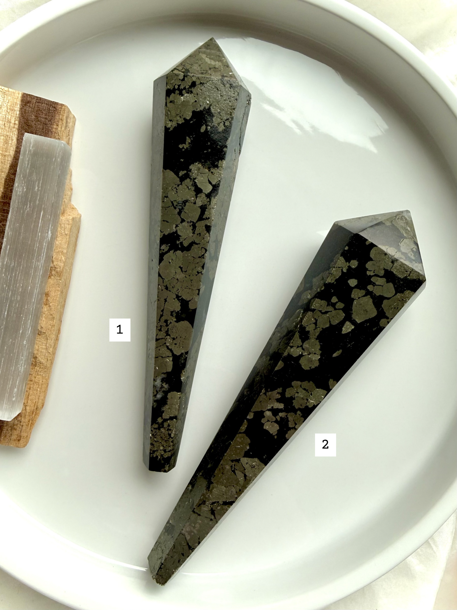 pyrite wand in black matrix two polished crystal points labeled for selection