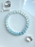 Close-up of a single Aquamarine crystal bracelet in luminous blue ombré – March birthstone jewelry