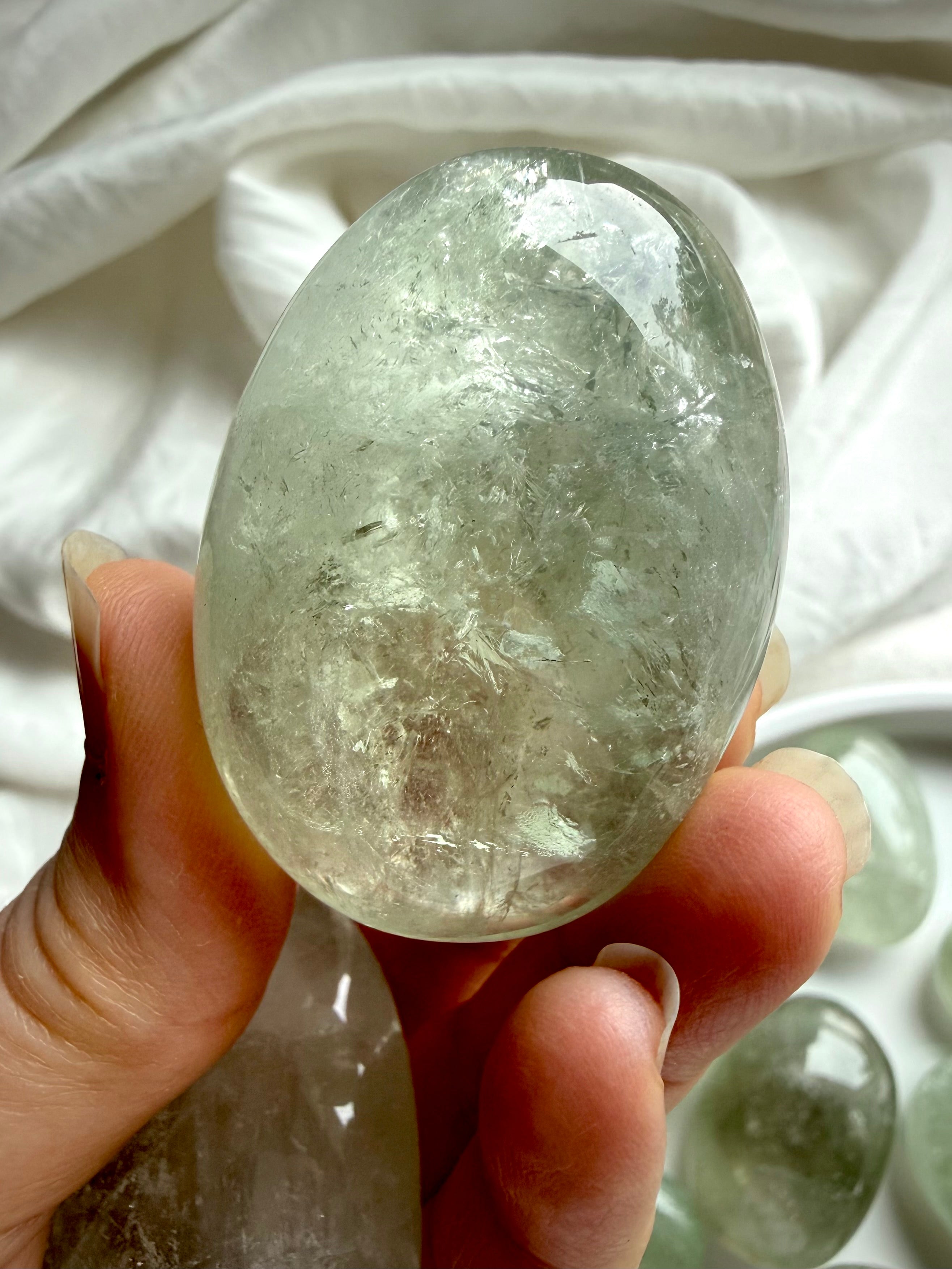Large Prasiolite palm stone with internal veils and natural green crystal patterning