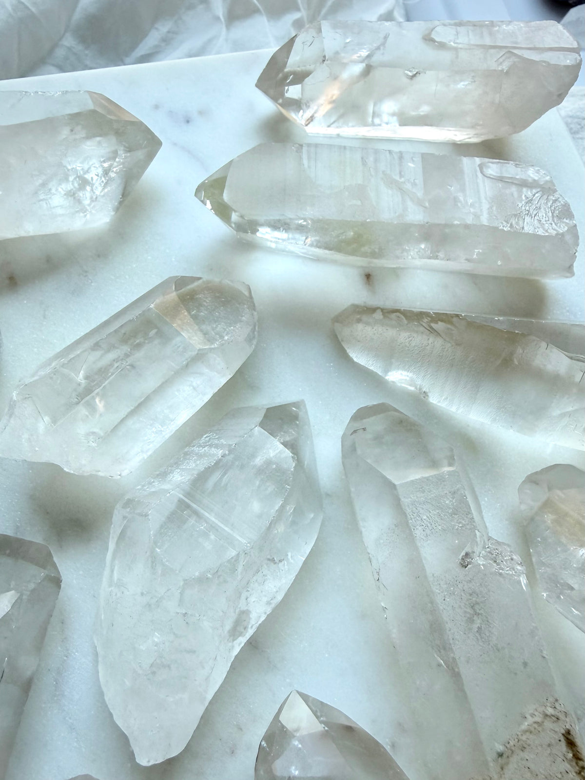 Lemurian Quartz showing textured horizontal ladder lines and natural growth striations across the crystal surface