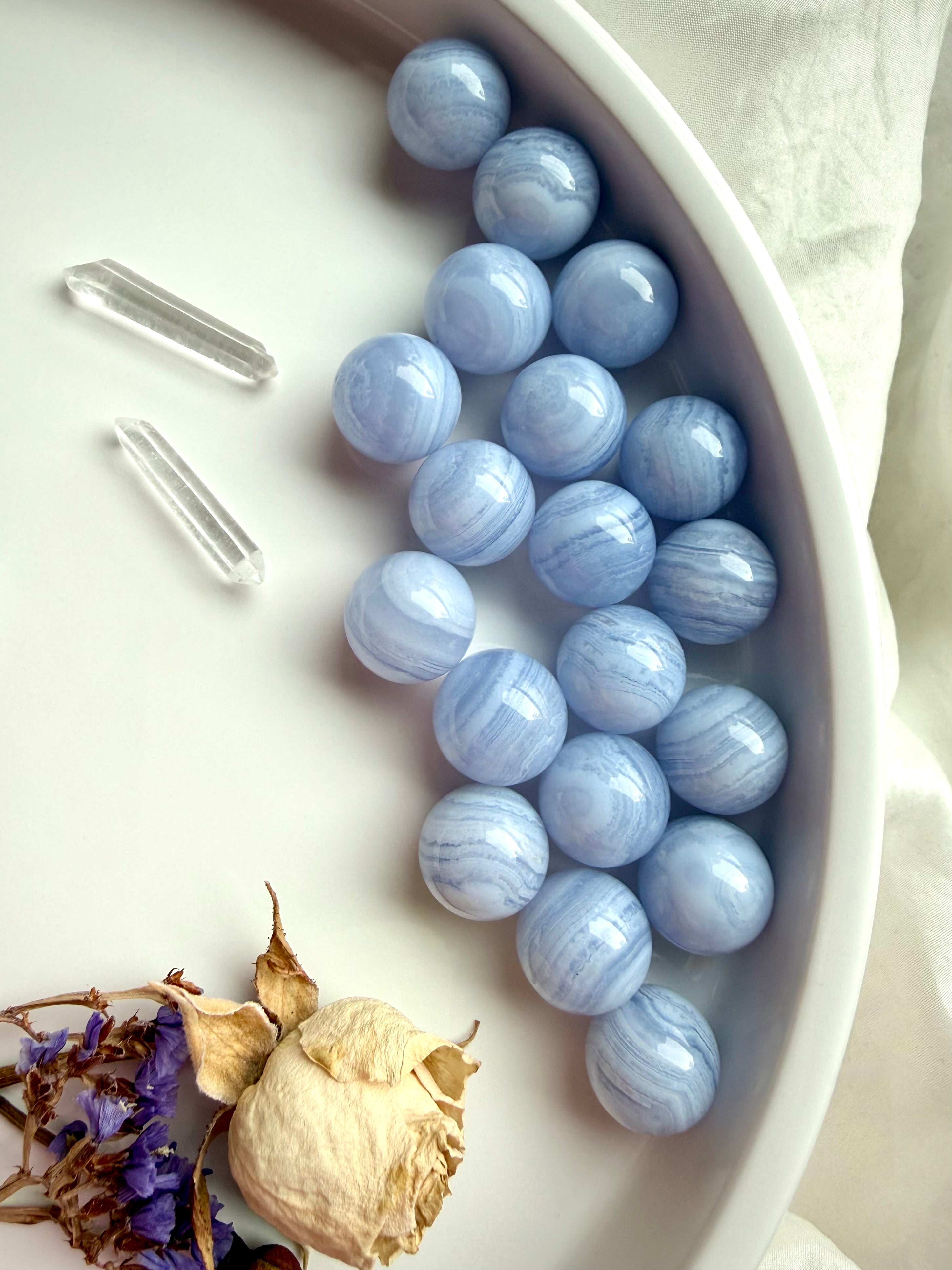 Soothing Blue Lace Agate spheres, a throat chakra crystal of clear, heart-centered communication.