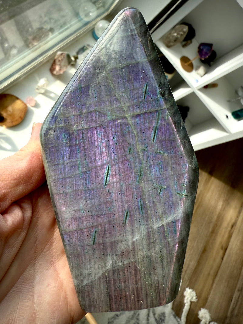 A rare purple Labradorite Freeform with a spectrum of sunset colors to activate the third eye chakra