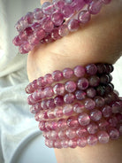 Pink Tourmaline bracelet collection showcasing natural color variation from blush pink to rich berry tones with beautiful translucency