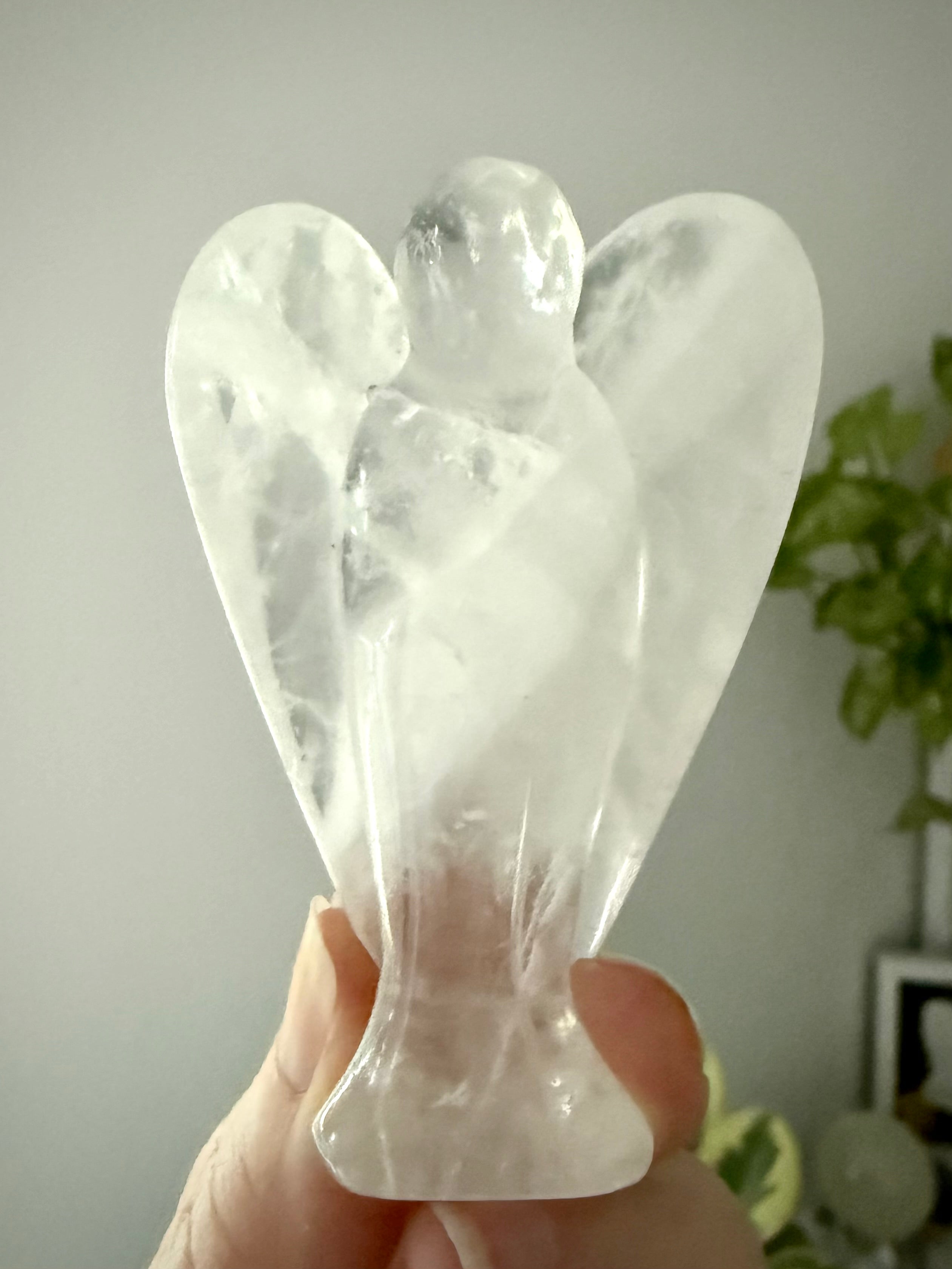 This Clear Quartz Crystal Angel Figurine easily fits in with any style of decor or color scheme