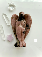 Natural Rhodonite crystal guardian angel with rosy coloring and polished wings for emotional balance