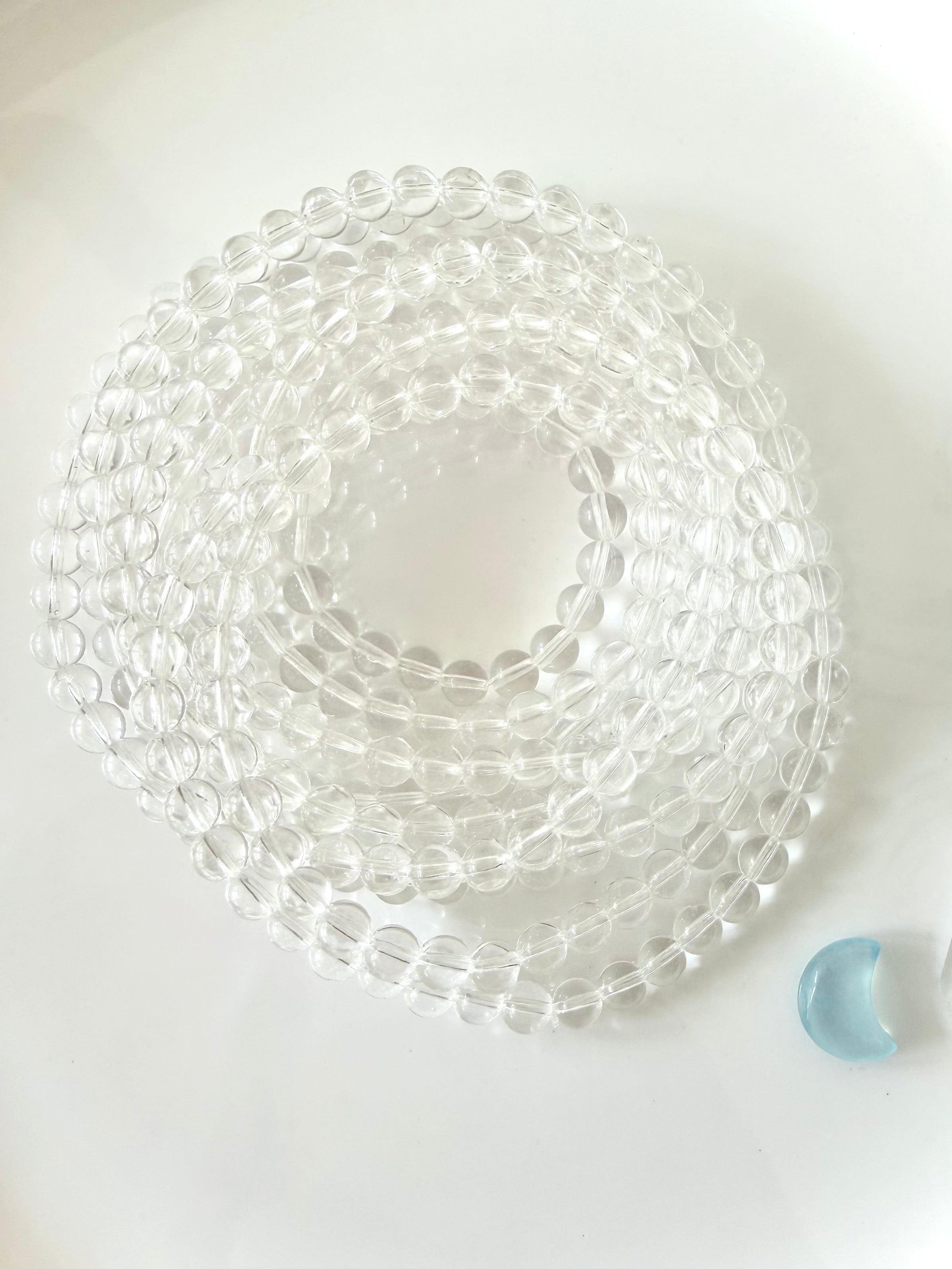 Coiled Clear Quartz bracelet displaying transparent crystal beads with exceptional natural clarity