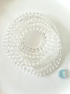 Coiled Clear Quartz bracelet displaying transparent crystal beads with exceptional natural clarity