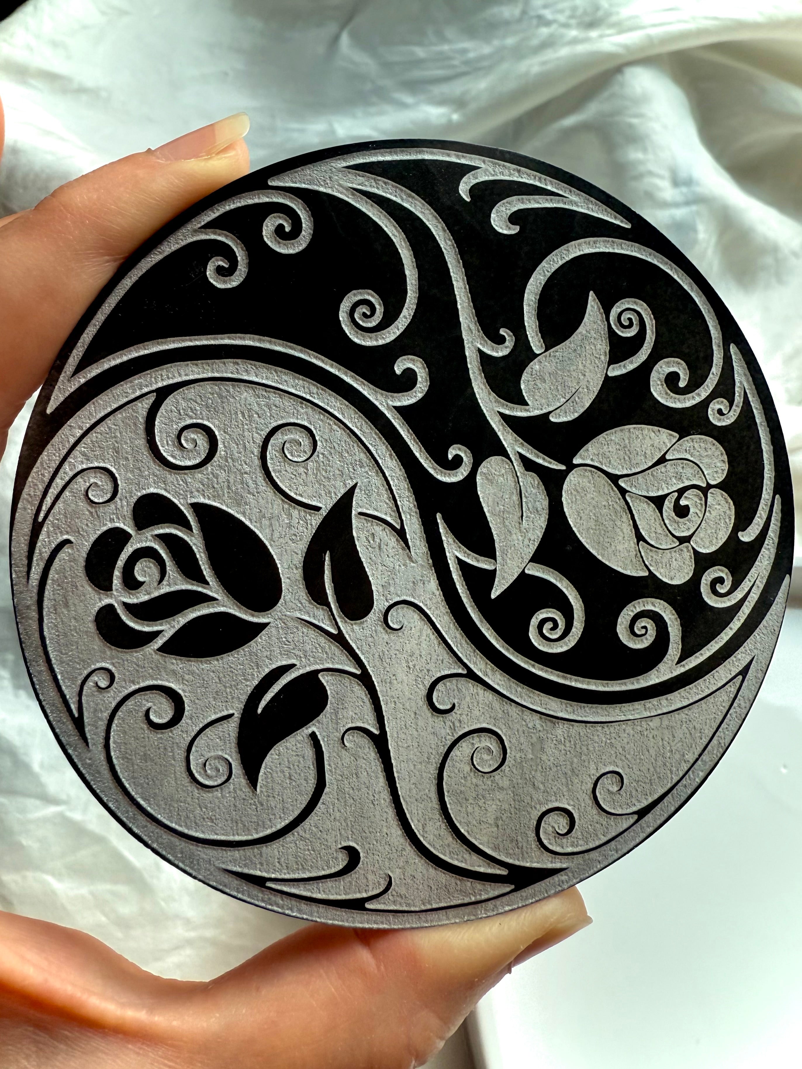 Carved rose and swirl pattern on yin yang selenite charging plate for crystal grids and energy work