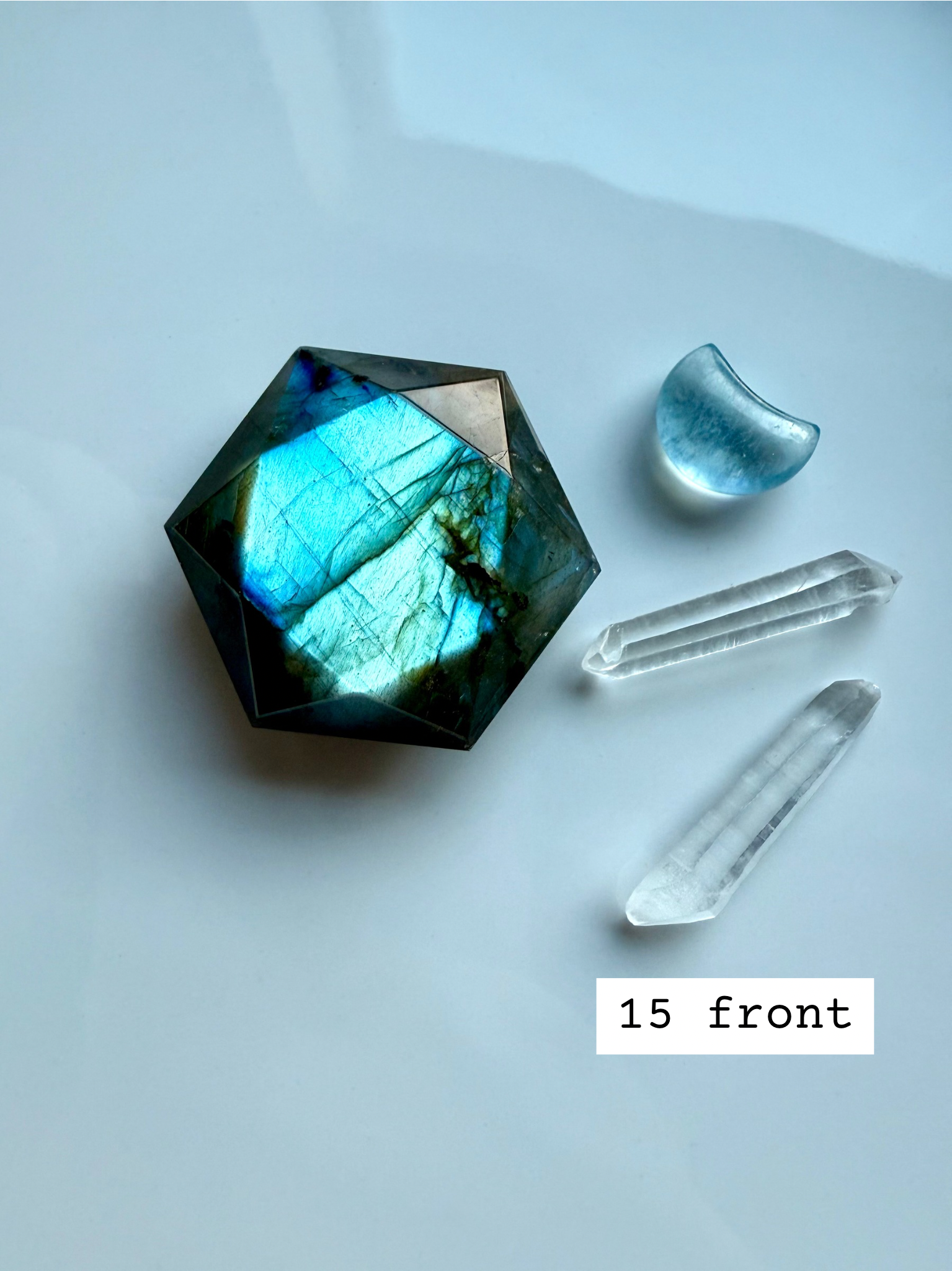 faceted labradorite hexagon with bright aqua flash styled with quartz points crystal star of david for intuition and psychic awareness