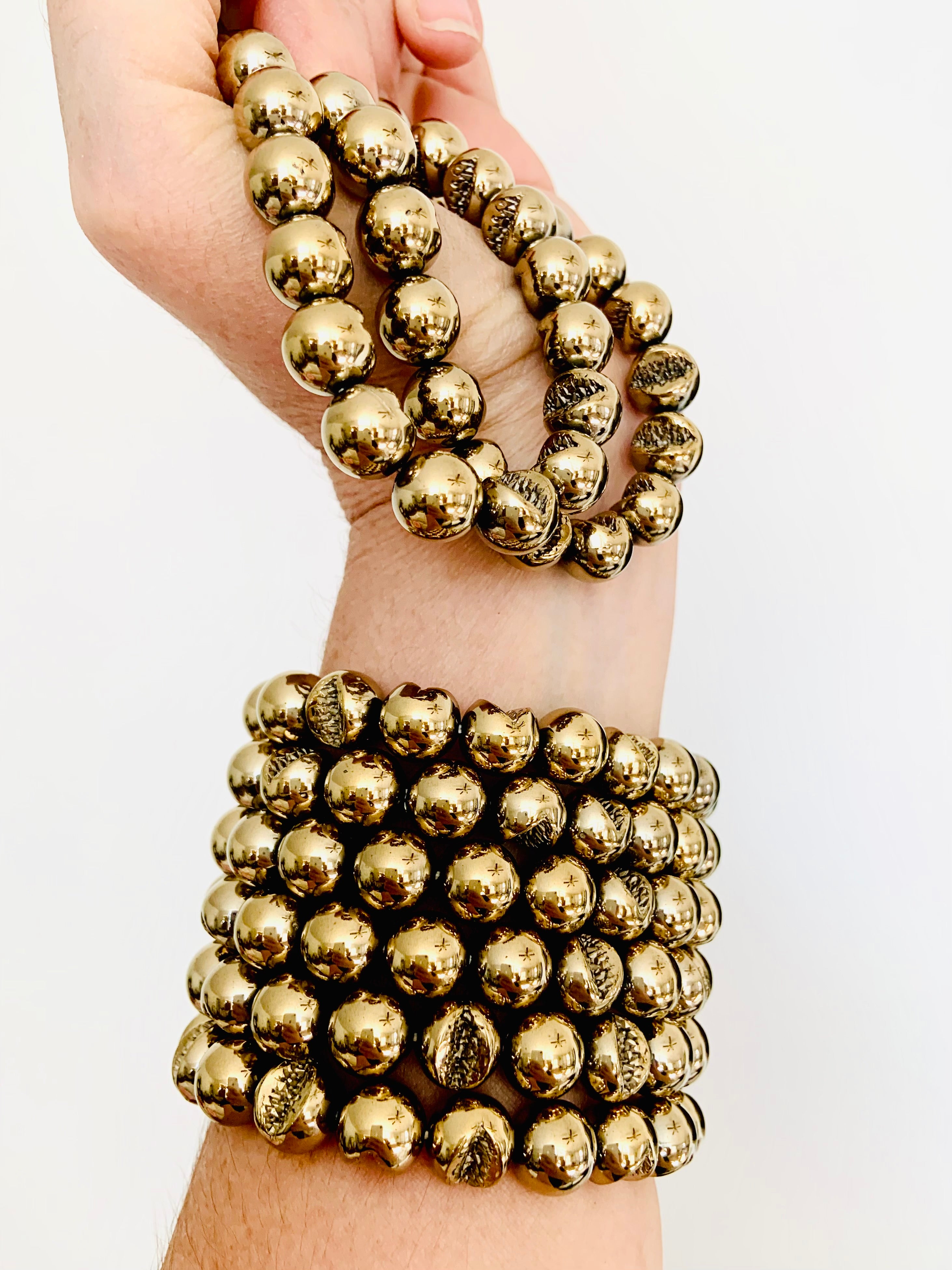 Stacked Pyrite bead bracelets on wrist: empowering crystal for success, willpower & energetic protection