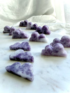 Natural Lepidolite cloud carvings in dreamy lilac and lavender hues for emotional healing and peaceful spaces