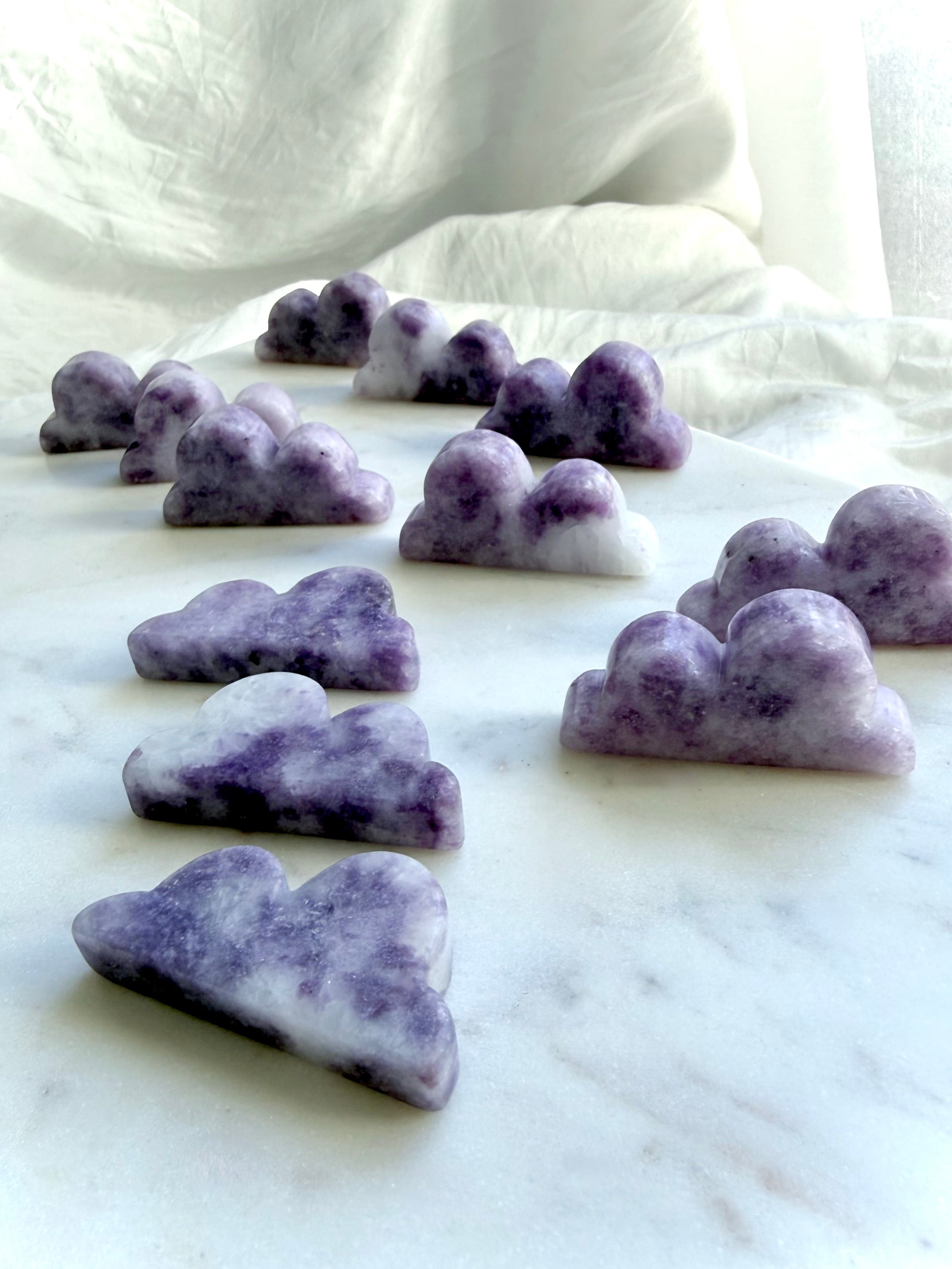 Natural Lepidolite cloud carvings in dreamy lilac and lavender hues for emotional healing and peaceful spaces