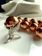 Botanical Metal Stand shown with the Michigan copper sphere option available in the dropdown menu
