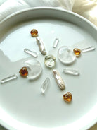 Sacred geometry crystal grid with faceted Citrine hexagons, crystal moons, and Clear Quartz points for abundance and manifestation