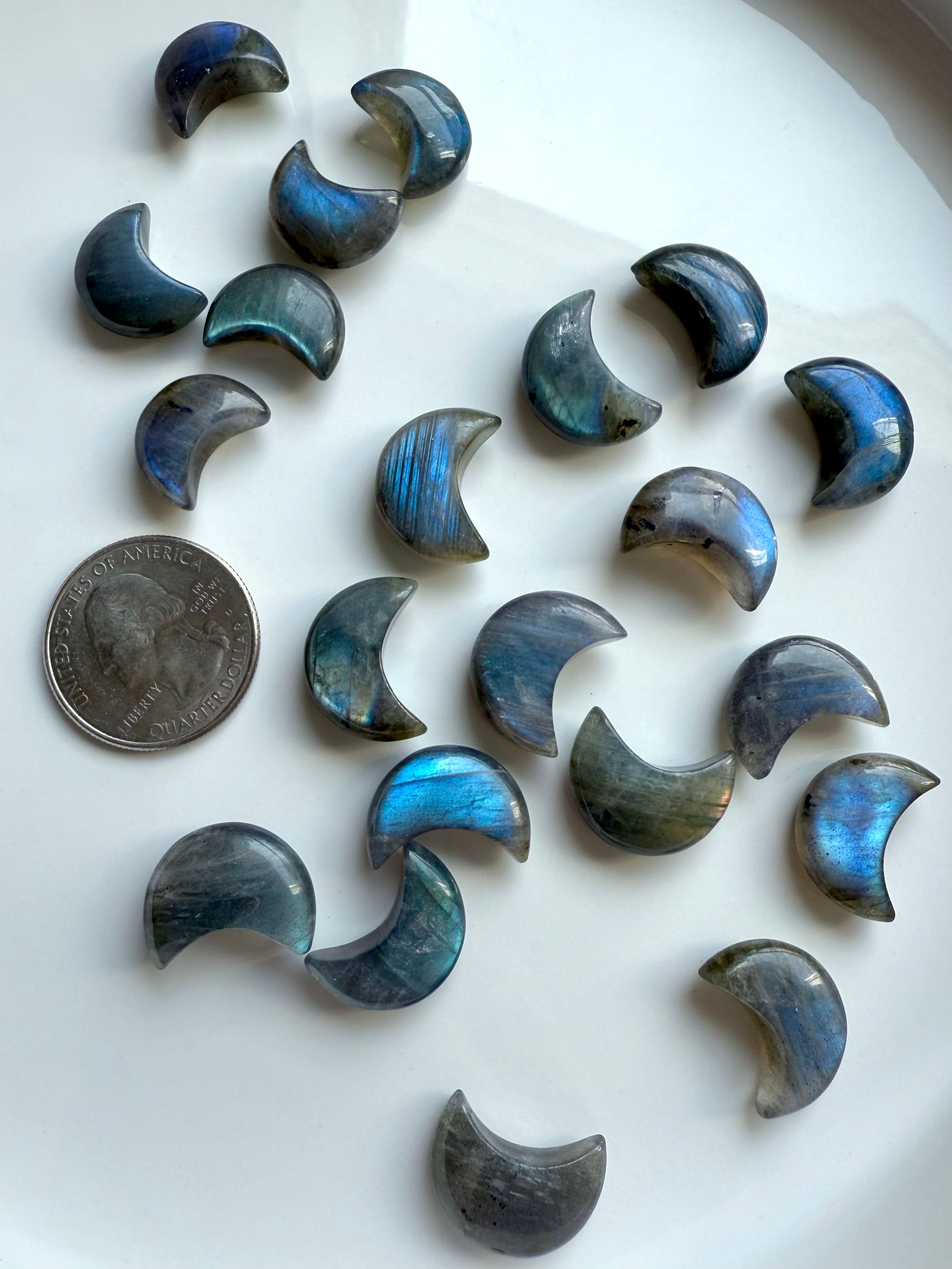 Array of mini Labradorite moon carvings with a quarter for scale — Third Eye crystal tools for inner vision, intuition & protective energy.