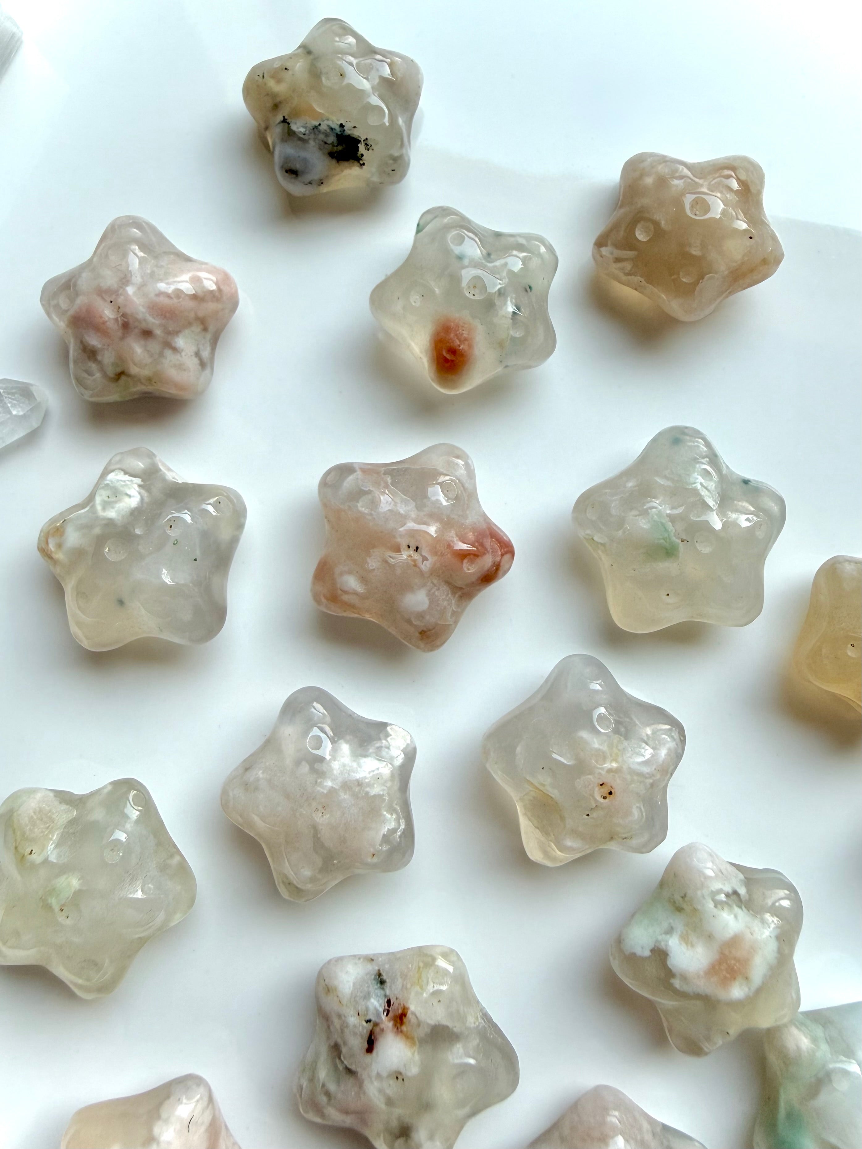 mini Flower Agate starfish crystals with soft pink, cream, and peach hues for heart chakra healing and new beginnings
