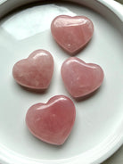 Rose Quartz palm-sized heart carvings with soft pink tones, crystals for self-love, emotional healing and Heart Chakra rituals