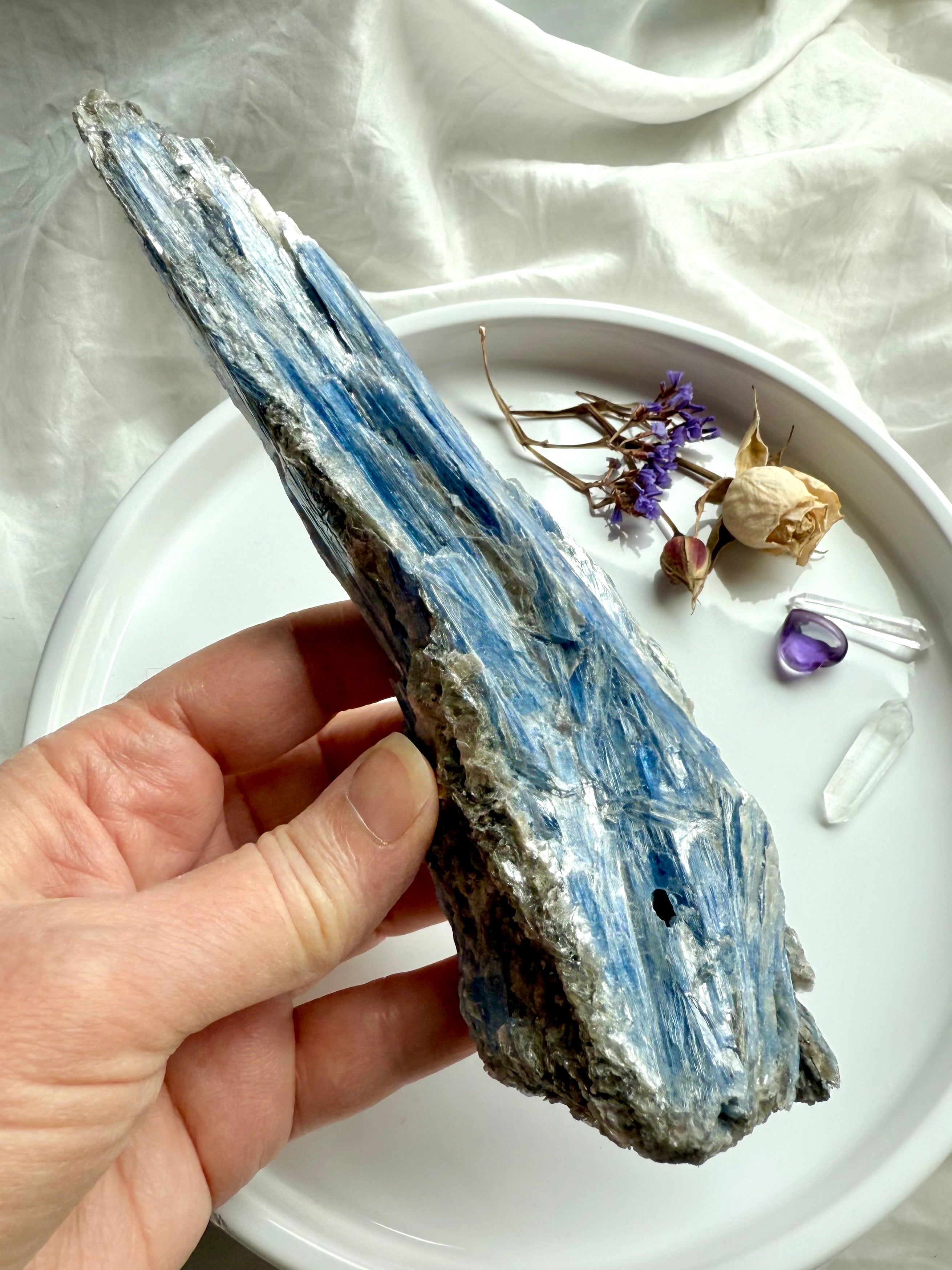 One of a kind raw blue kyanite and muscovite crystal specimen held in hand, natural healing stone for clarity and alignment