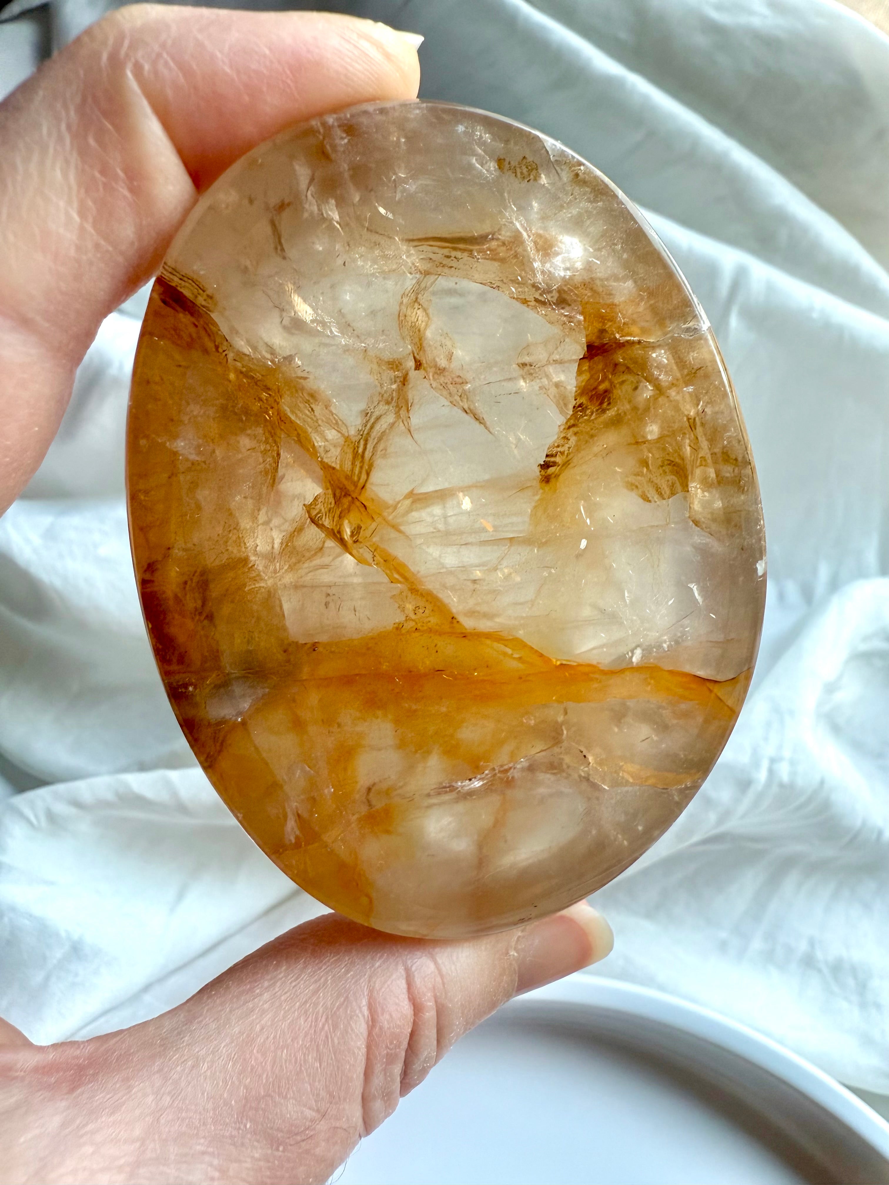 Golden Healer Quartz bowl closeup showing natural golden streaks and internal mineral patterns 
