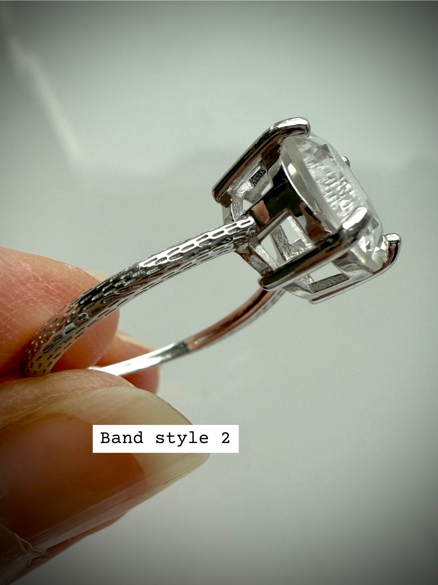 Side view of Band Style 2 – Clear Quartz Moon Ring with textured dotted silver band and raised setting