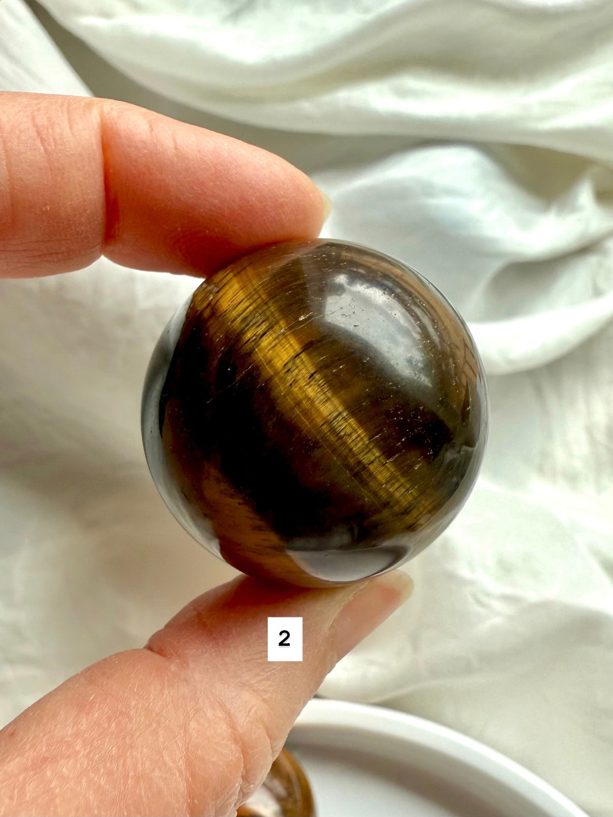 Tiger’s Eye Sphere #2 – close-up of crystal with rich golden-brown stripes for clarity &amp; protection