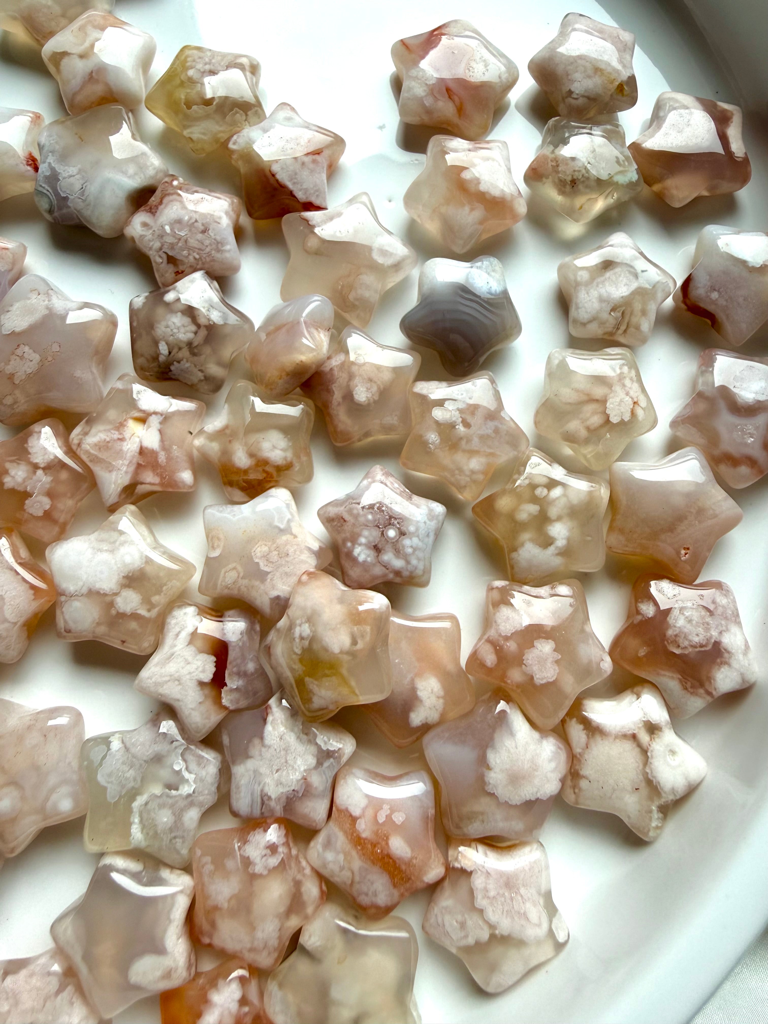 Mini Flower Agate crystal stars with blooming floral plumes in blush pink, cream, and translucent chalcedony tones