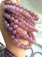 Lavender Rose Quartz crystal bracelet with luminous Madagascar gemstone beads in shifting pink and lavender tones