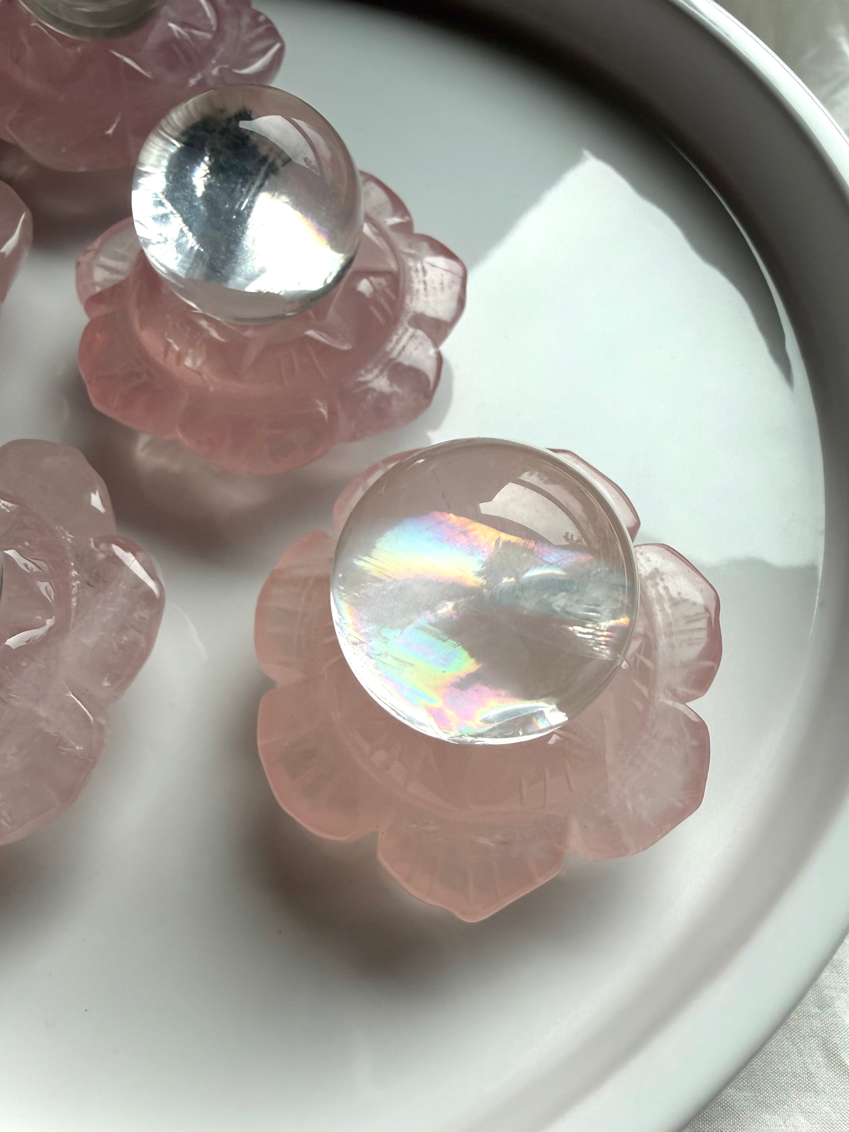 Mini girasol quartz crystal spheres styled in Rose Quartz lotus flower crystal holders, sacred home and altar decor