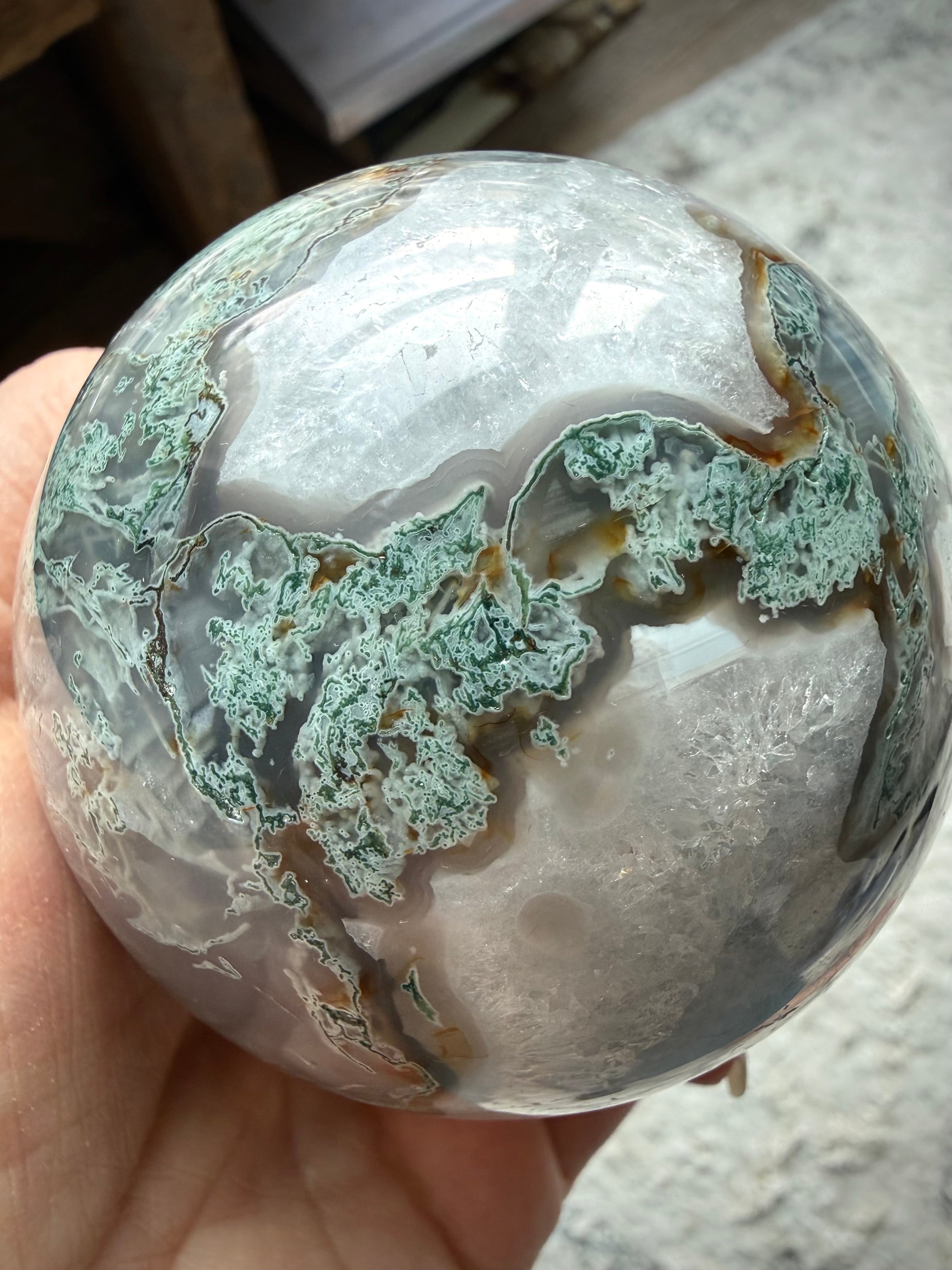 Polished Moss Agate crystal ball with garden-like inclusions and natural stone details