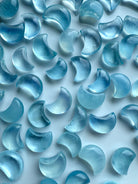 Closeup of polished Aquamarine Mini Moons showing high-clarity gemstone detail and color variation — ideal for mini altars and pocket talismans