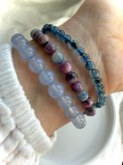 Ruby Sapphire bracelets worn with blue chalcedony & aquamarine crystal bracelets for gemmy stacking ideas