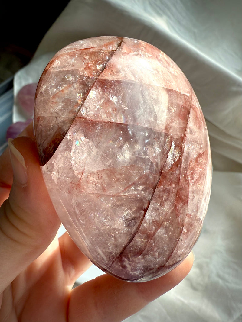 an extra large Fire Quartz Palmstone with rainbows