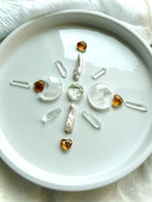 Citrine crystal grid with mini faceted hexagons, Clear Quartz points, and Citrine moon carvings for manifestation