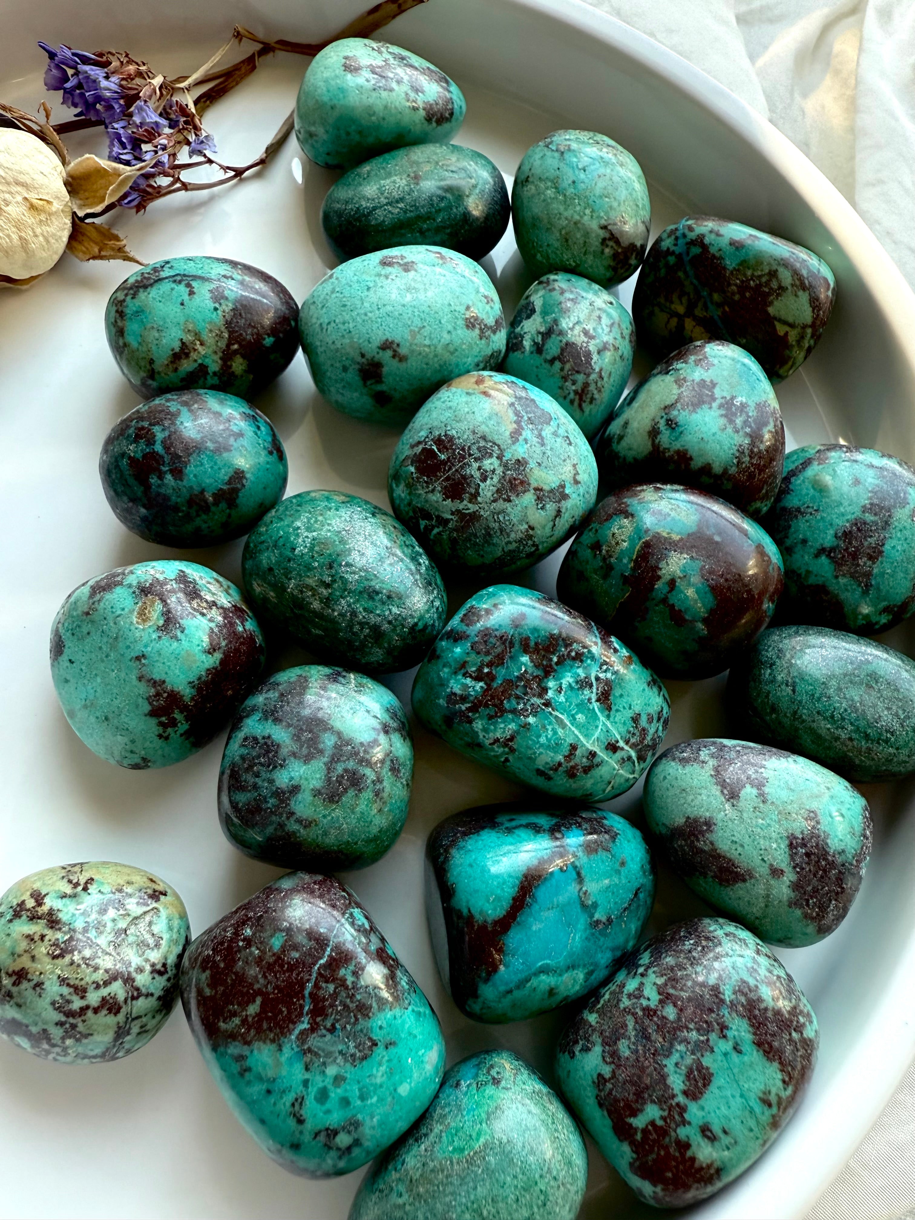 Chrysocolla tumbles with turquoise, teal, and rusty red Cuprite patterning, polished crystals for heart and throat chakra healing.