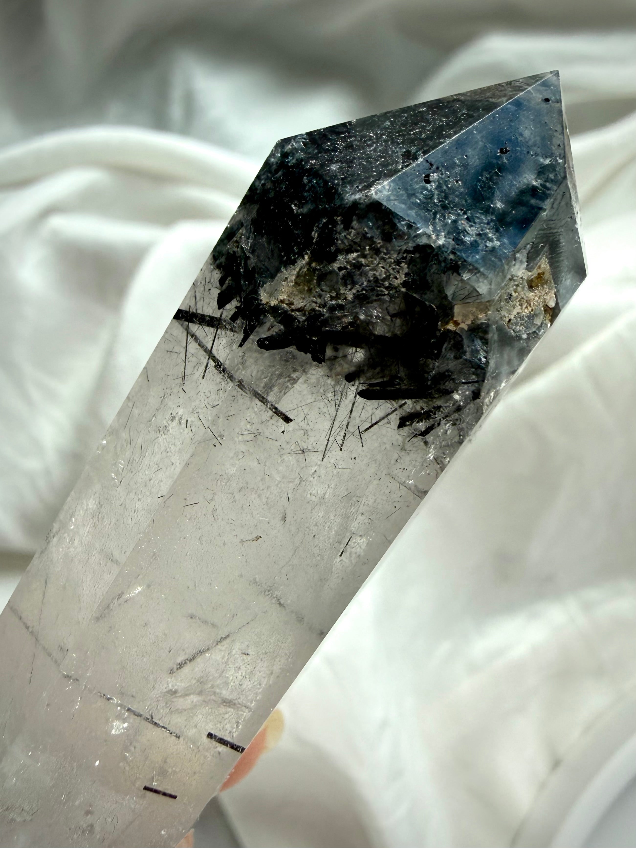 double terminated quartz crystal with black tourmaline needles and natural mineral texture