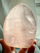 Premium Rose Quartz freeform stone with glassy pink translucence and mystical light-filled appearance