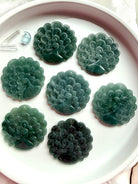 Collection of hand-carved Blue Water Jade peacock medallions in assorted natural tones