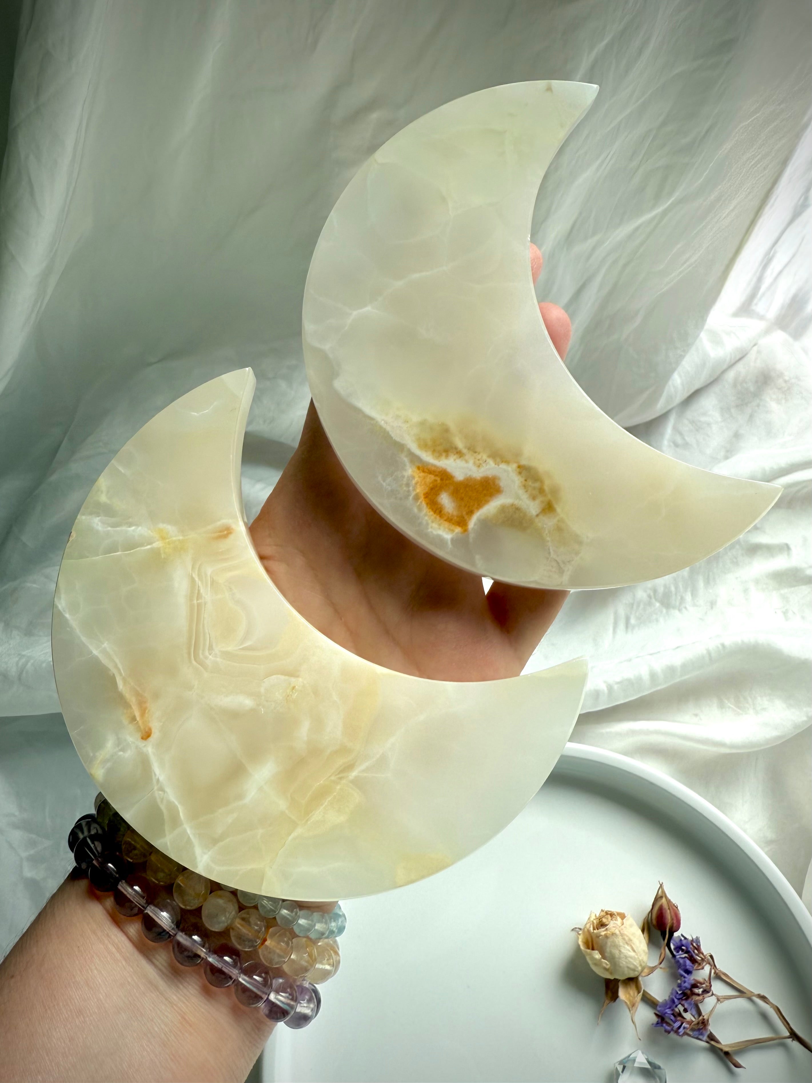 White Onyx Crescent Moon Plates – crystal carvings with creamy white and honey tones for altar decor and lunar rituals