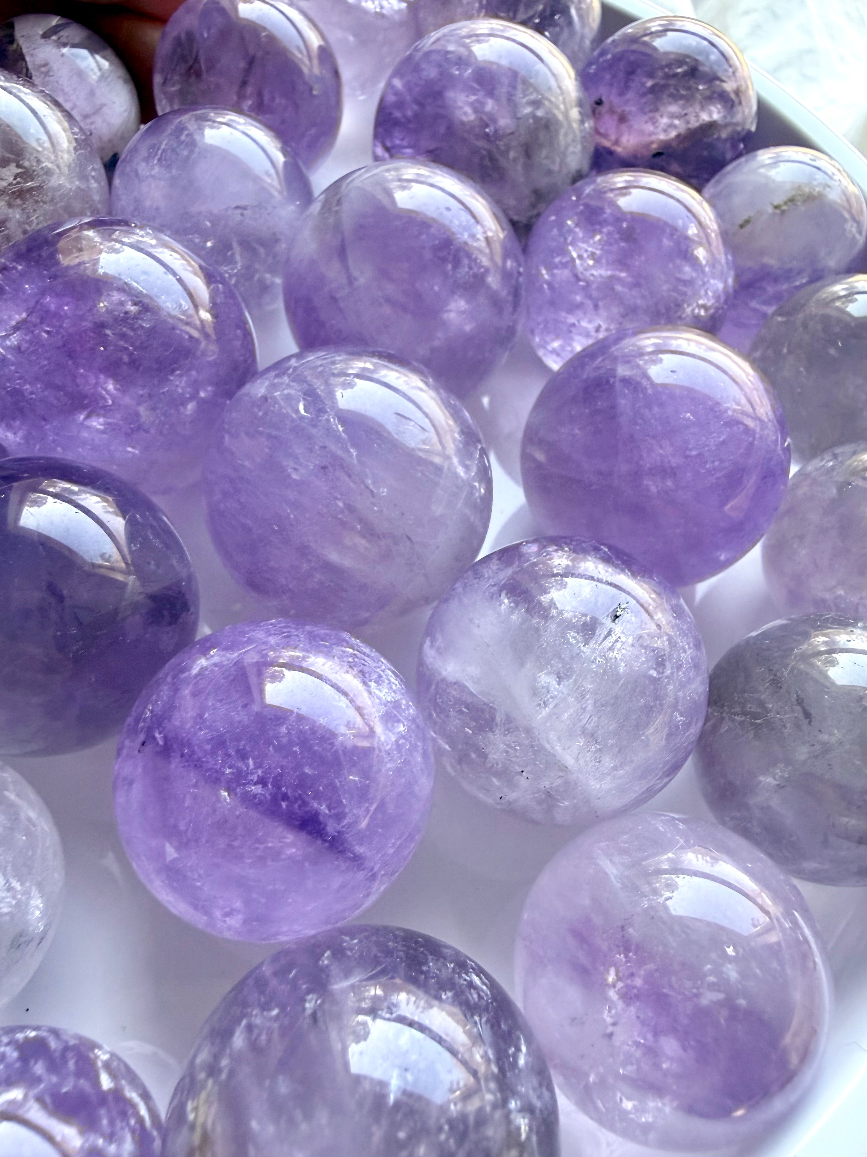 small amethyst crystal balls with smoky inclusions polished mini gemstone spheres